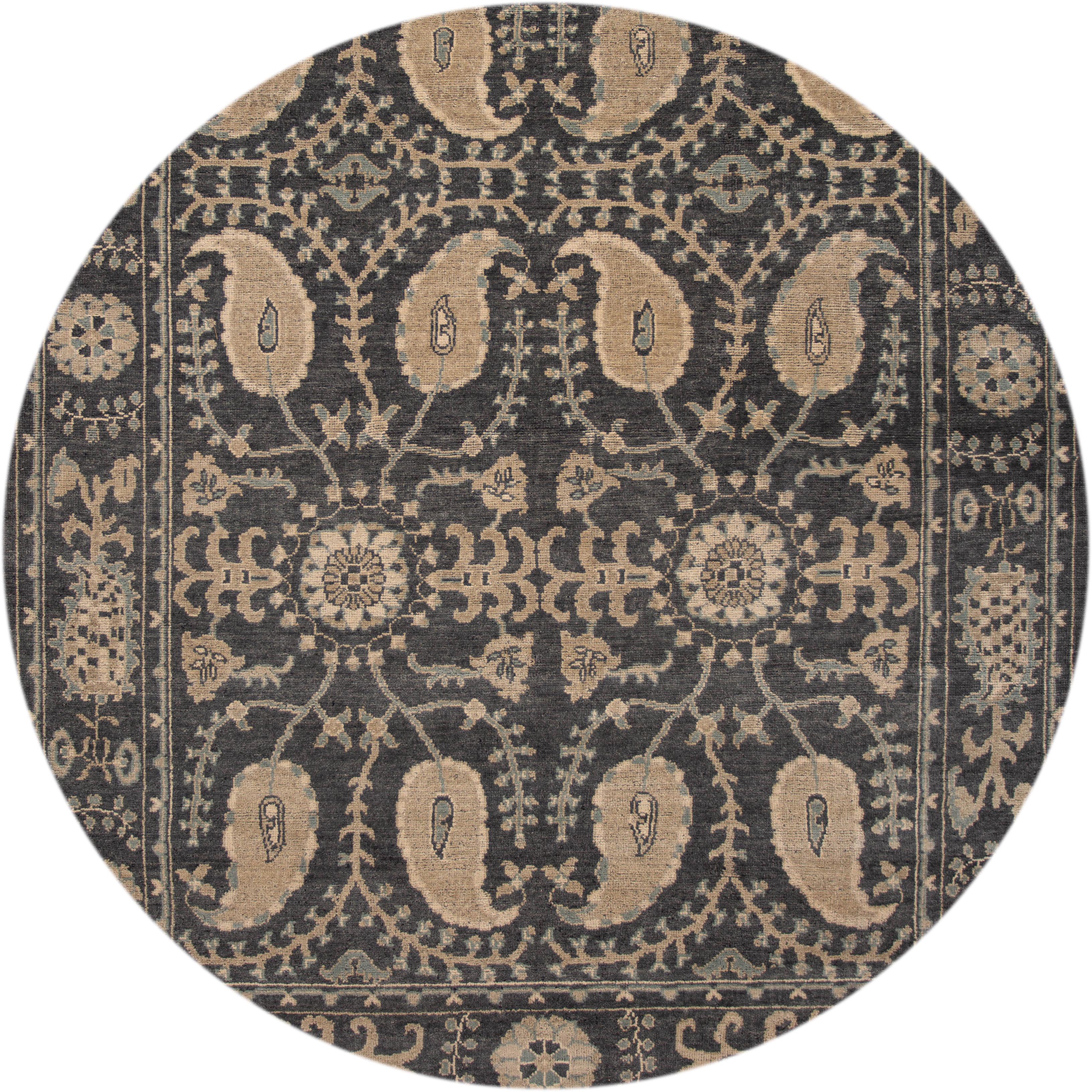 Beautiful contemporary Oushak rug, hand knotted wool with a dark gray field, ivory and tan accents in an all-over Classic motif,
circa 2019
This rug measures 9' 1