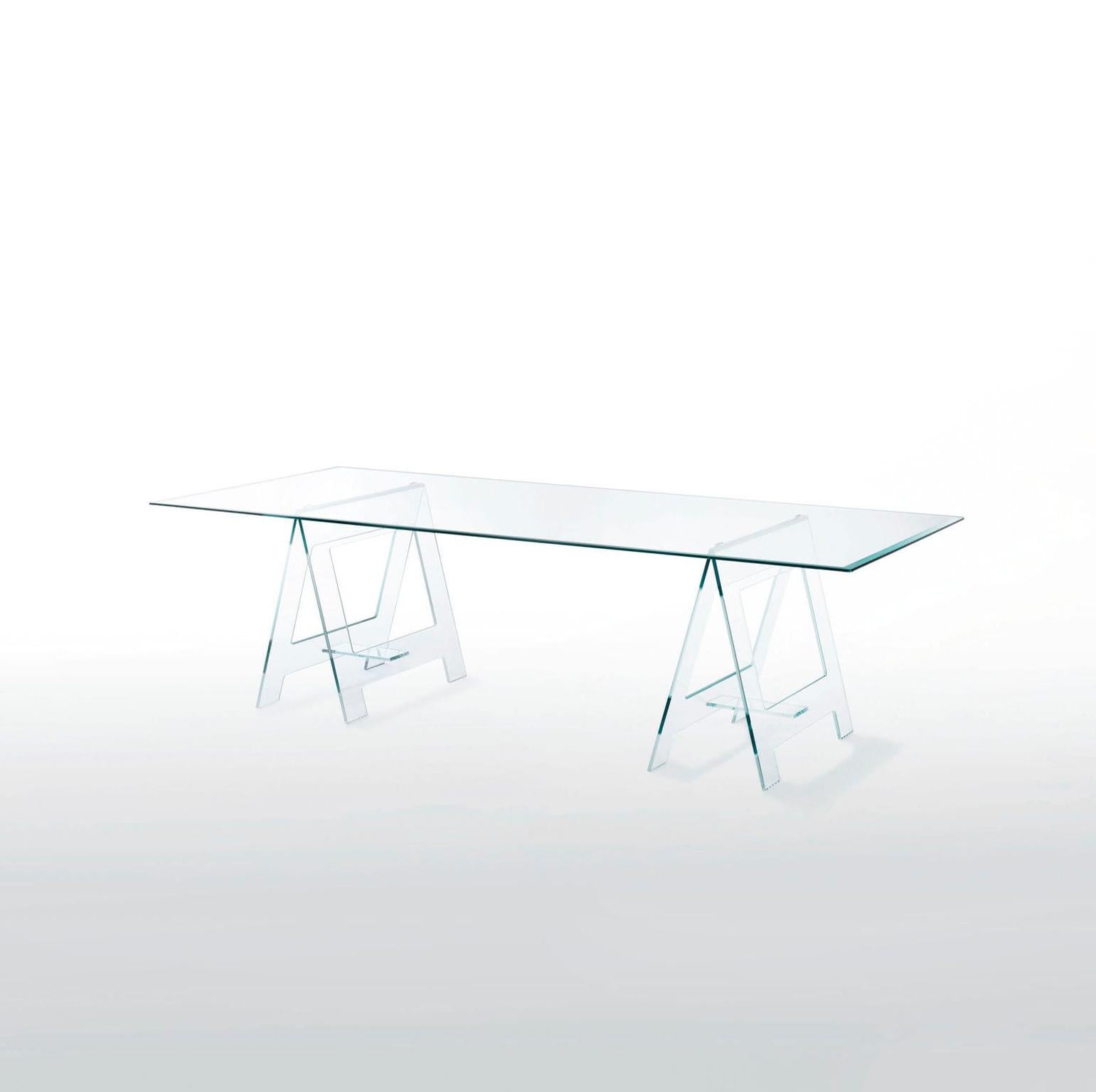 This is a very eclectic table cause it's unusual form with its top on a pair of easels made in clear crystal, it's an important table or desk but at the same time it’s a very light presence in a room.

The Italian design gives a touch of modernism