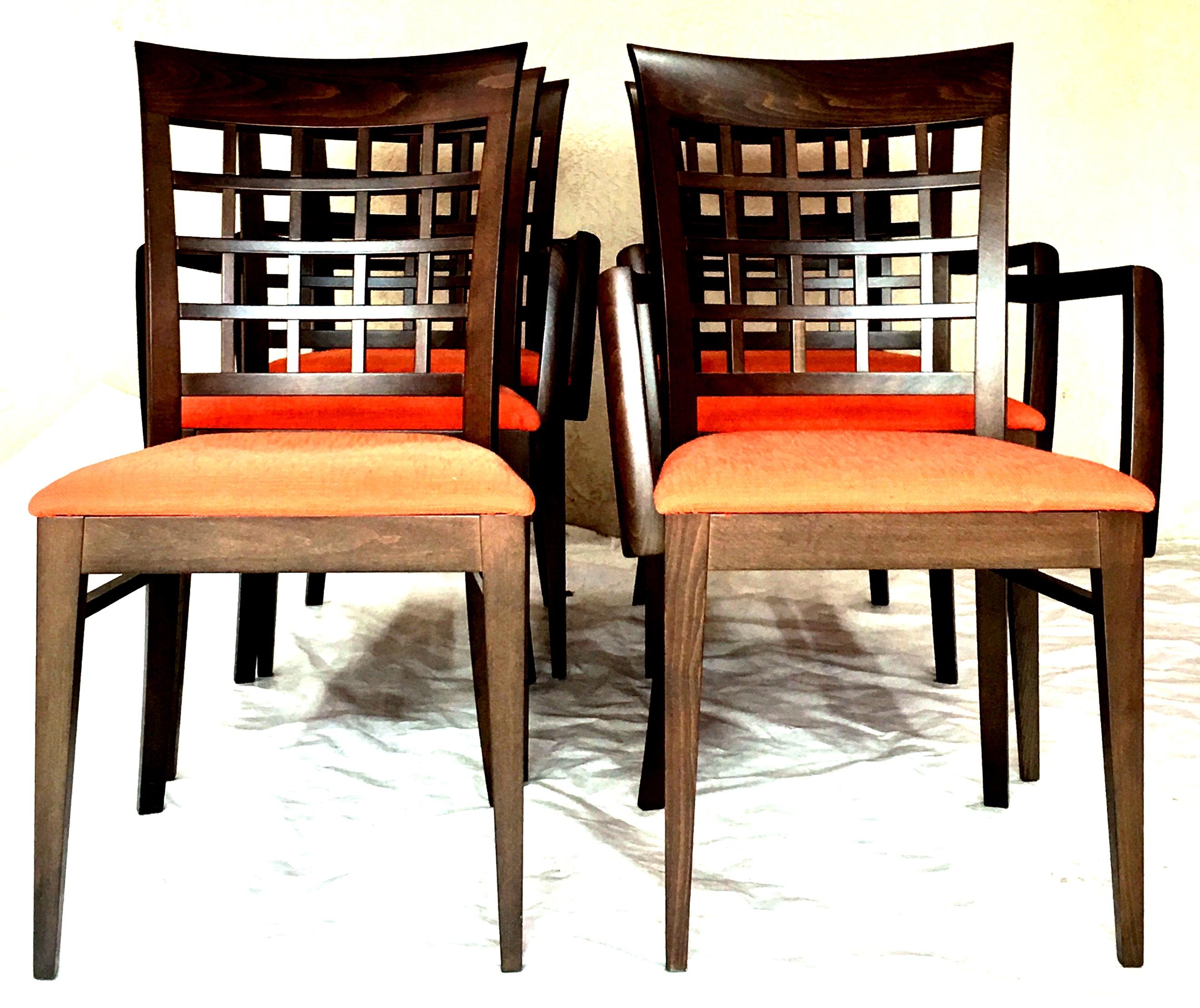 21st century Italian contemporary and modern upholstered dining chairs By, Potocco Spa for Roche Bobois. Features a dark mahogany stain solid wood frame with an orange linen blend upholstery fabric.
These like new, never used, contemporary set of