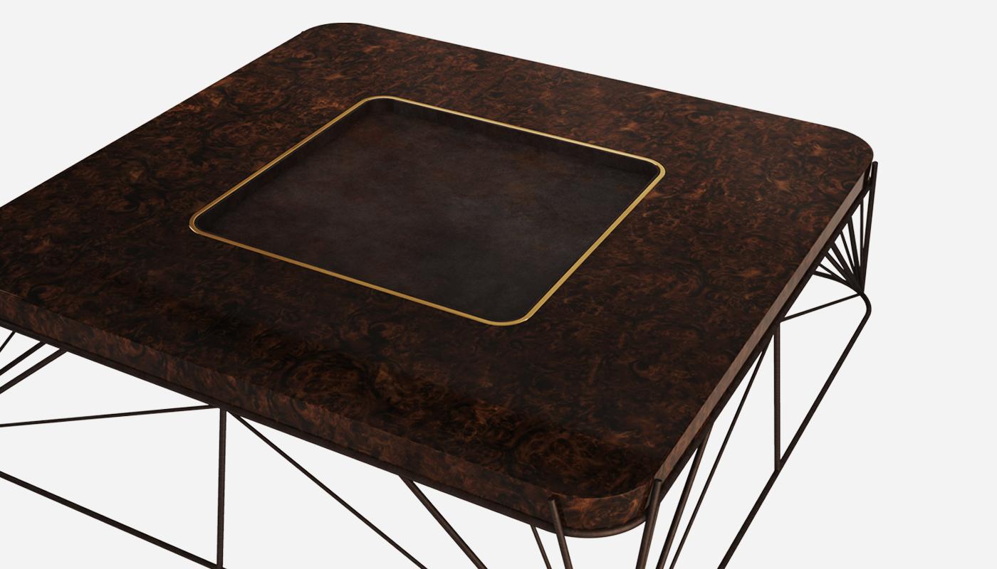 The desert utopia sculpture created by Donald inspired Porus Studio to design the Judd center table. The Mid-Century Modern table features a structure in brass with a terracotta finish, detailed with high glossed walnut wood at the center. The