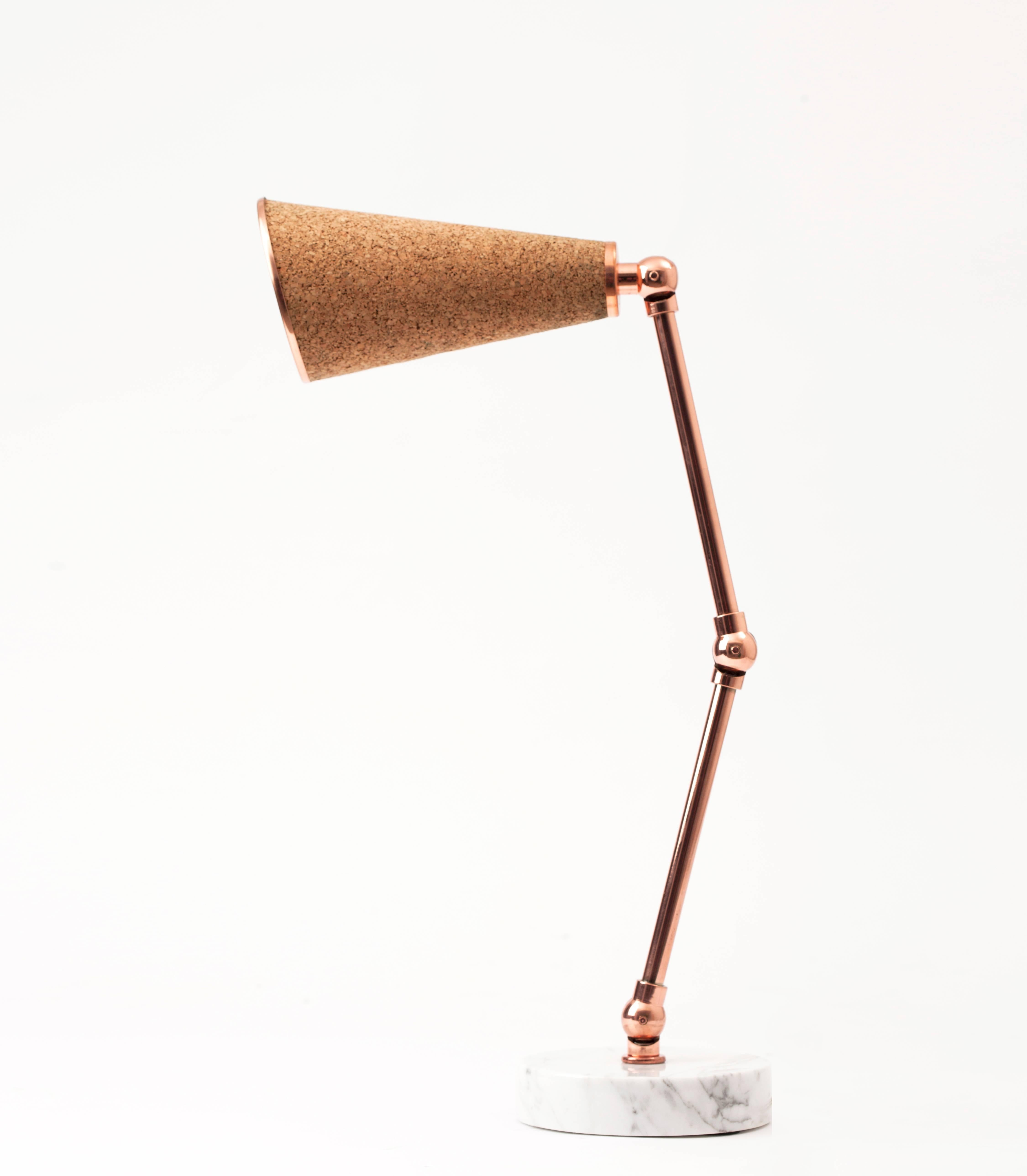 Lanterna is a new age robot lamp with a heart. Unique textured materials such as felt, cork and cowhide are combined with white and black colored marbles and shiny metals such as brass and copper. Adjustable arms of Lanterna enables users to justify