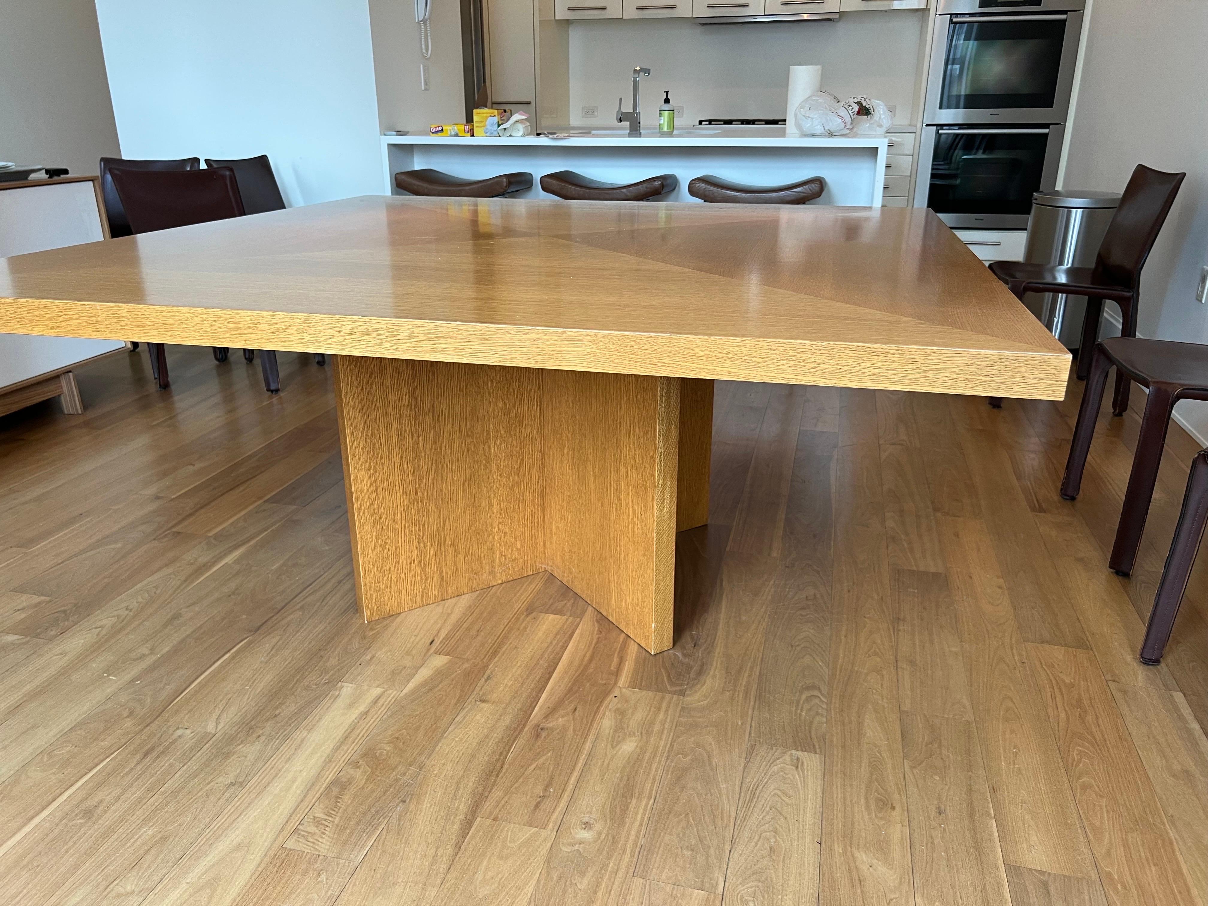 21st Century Large Custom Square Oak Dining Table
A large light honey finish oak square table. 
Very good condition. General wear to finish from age and use.  Two areas of loss to the center top of table.

65
