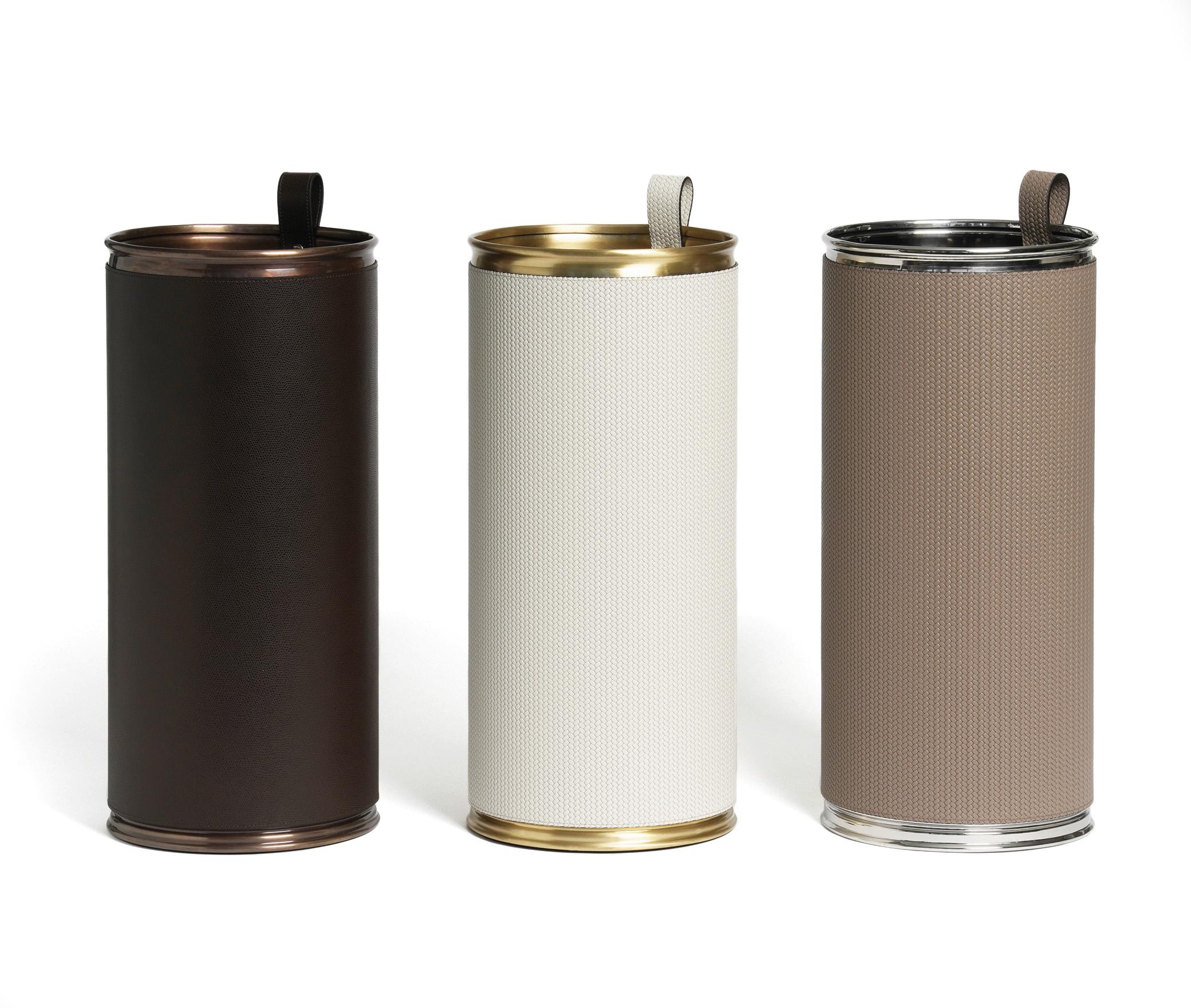 Stands out for its simplicity.

An umbrella stand with cylindrical silhouette ideal to give a stylish addition to any hallway. Covered with a soft grained or woven leather our umbrella stand is available with chrome, burnished or satin brass