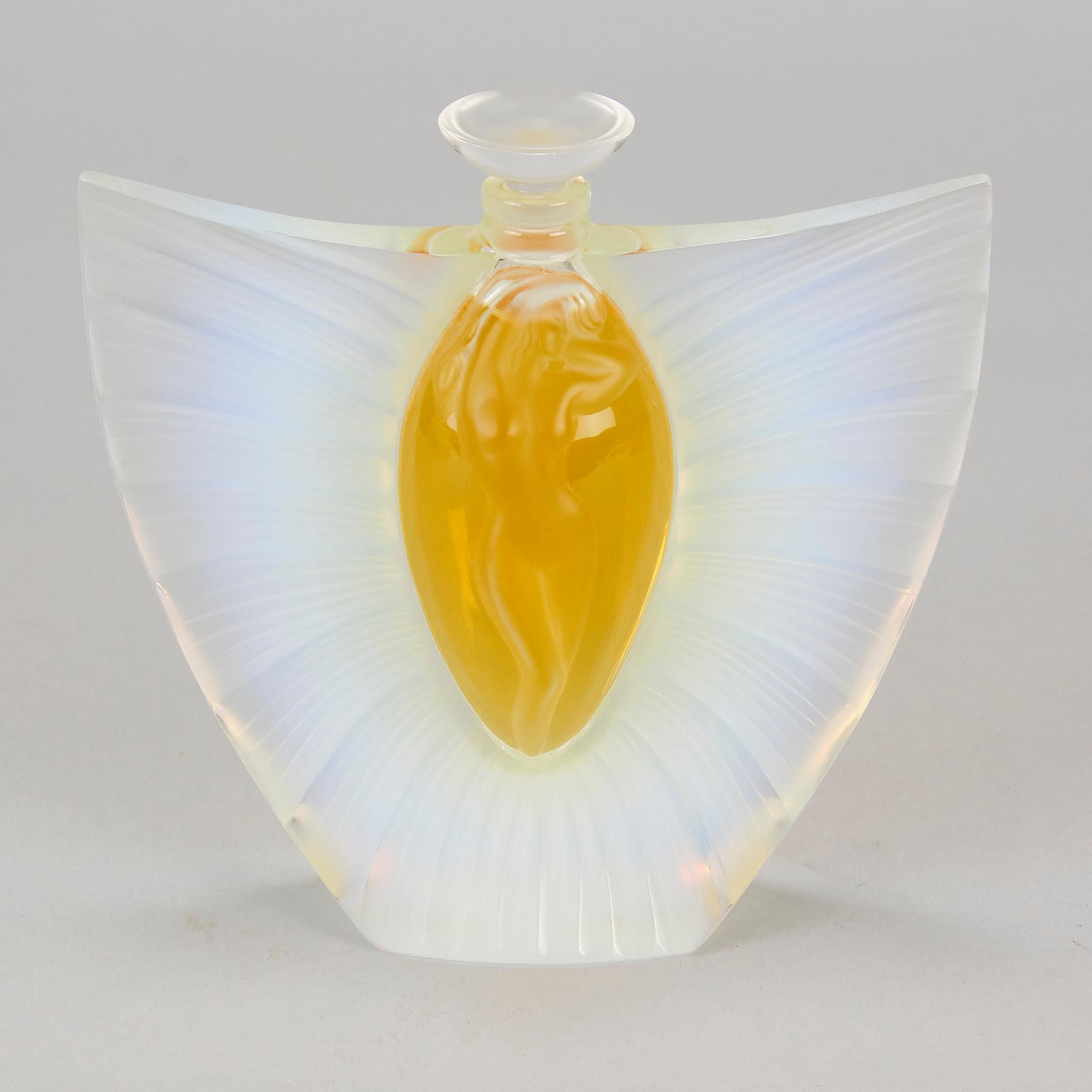A stunning late 20th Century French Limited edition opalescent crystal glass flacon, the sides with opening wings revealing a beautiful femal figure in the central cartouche. The flacon has wonderful depth and detail and is signed and