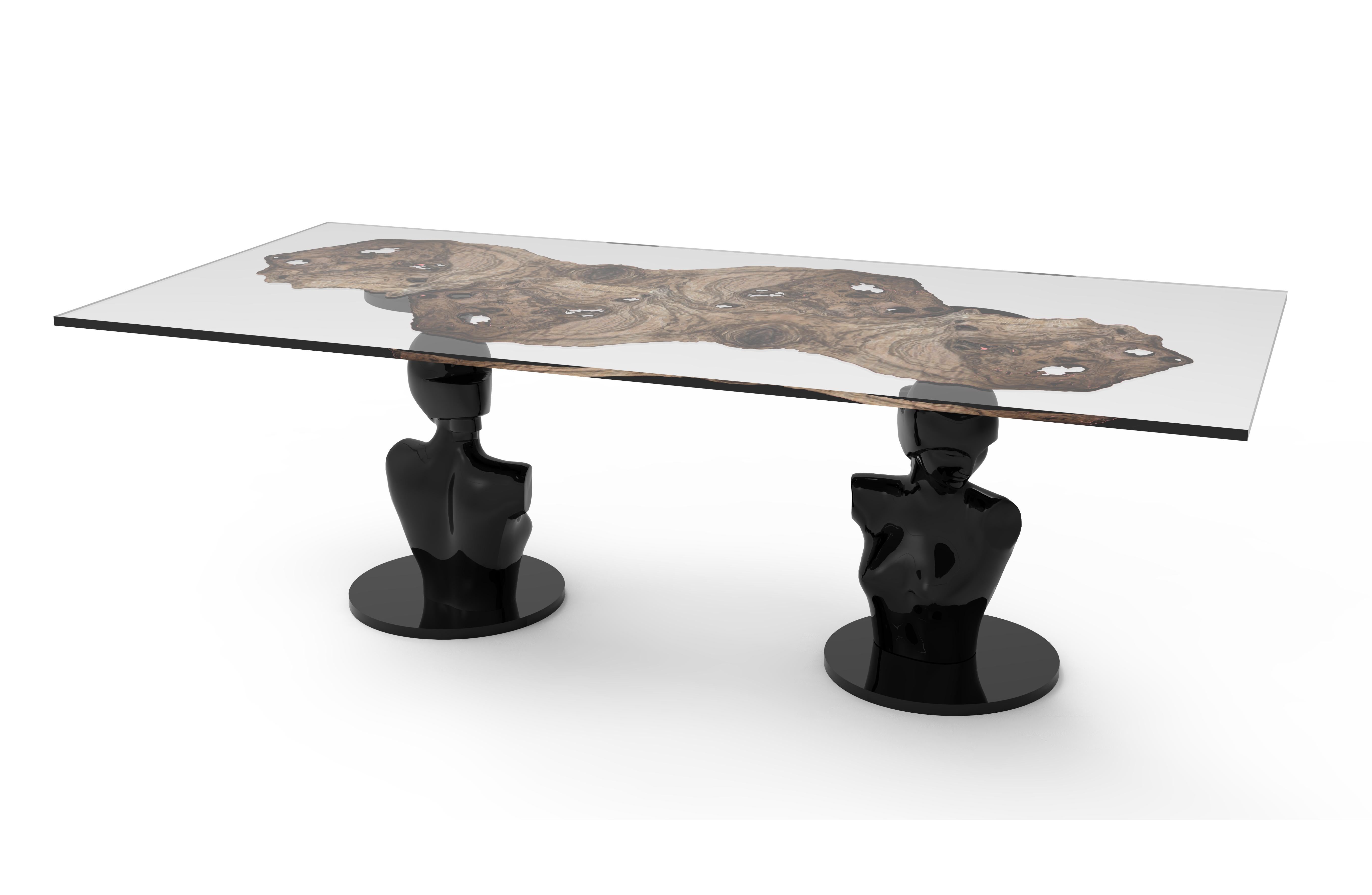 Lorsky is a table inspired by the Art Deco aesthetics of the 1920s and 1930s. The carved wooden base represents two sculptures of a warrior woman by Boris Lovet Lorski, one of the most important Art Deco sculptors. The table is a tribute to the
