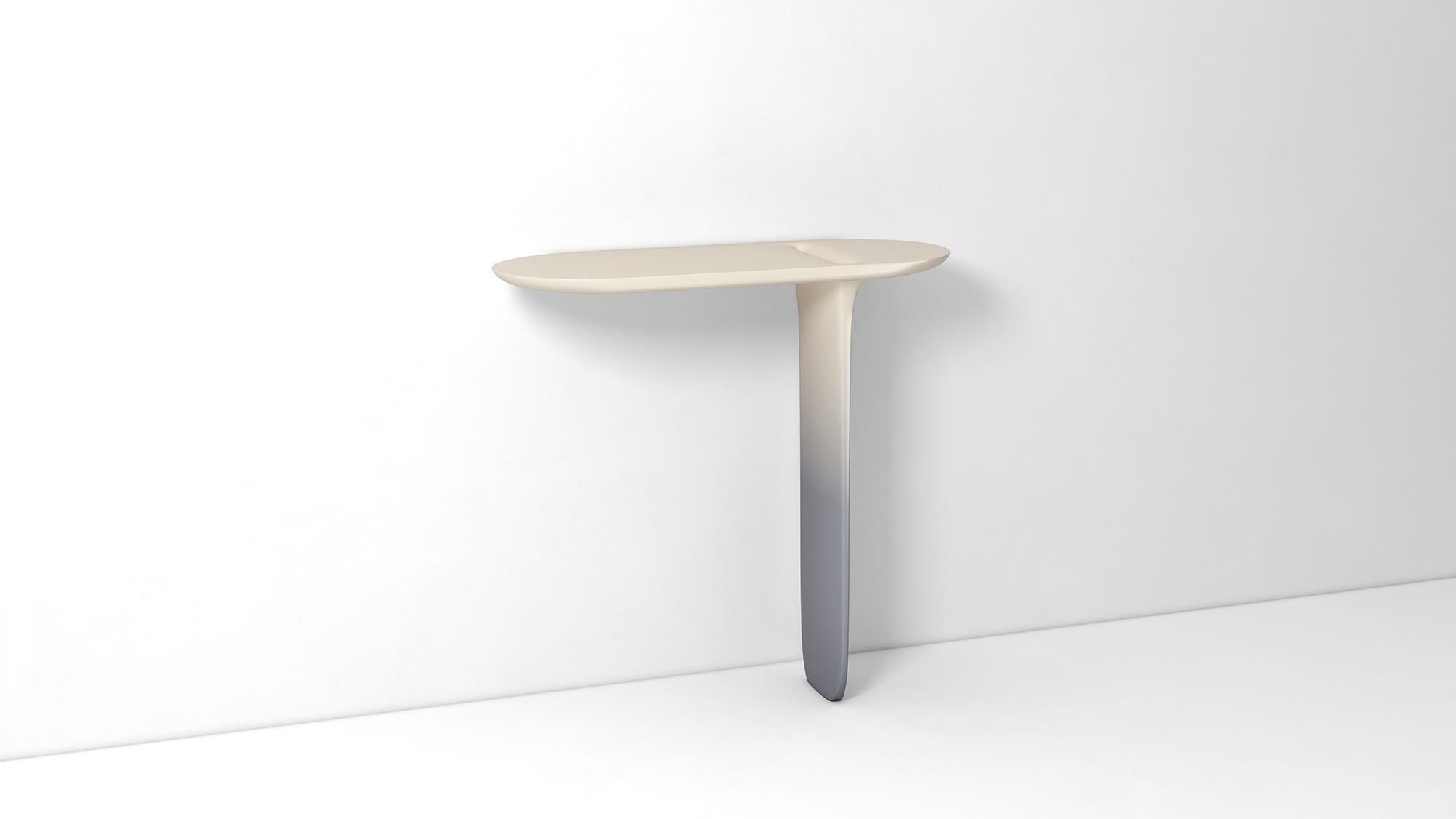 Ipsilon Console, design by Matteo Cibic, product by Scapin Collezioni
Limited Edition.

Matteo Cibic has designed a console with a liquid shape. Light and thin, Ipsilon stands elegantly and perfectly balanced on one leg.
Materials: Matt faded