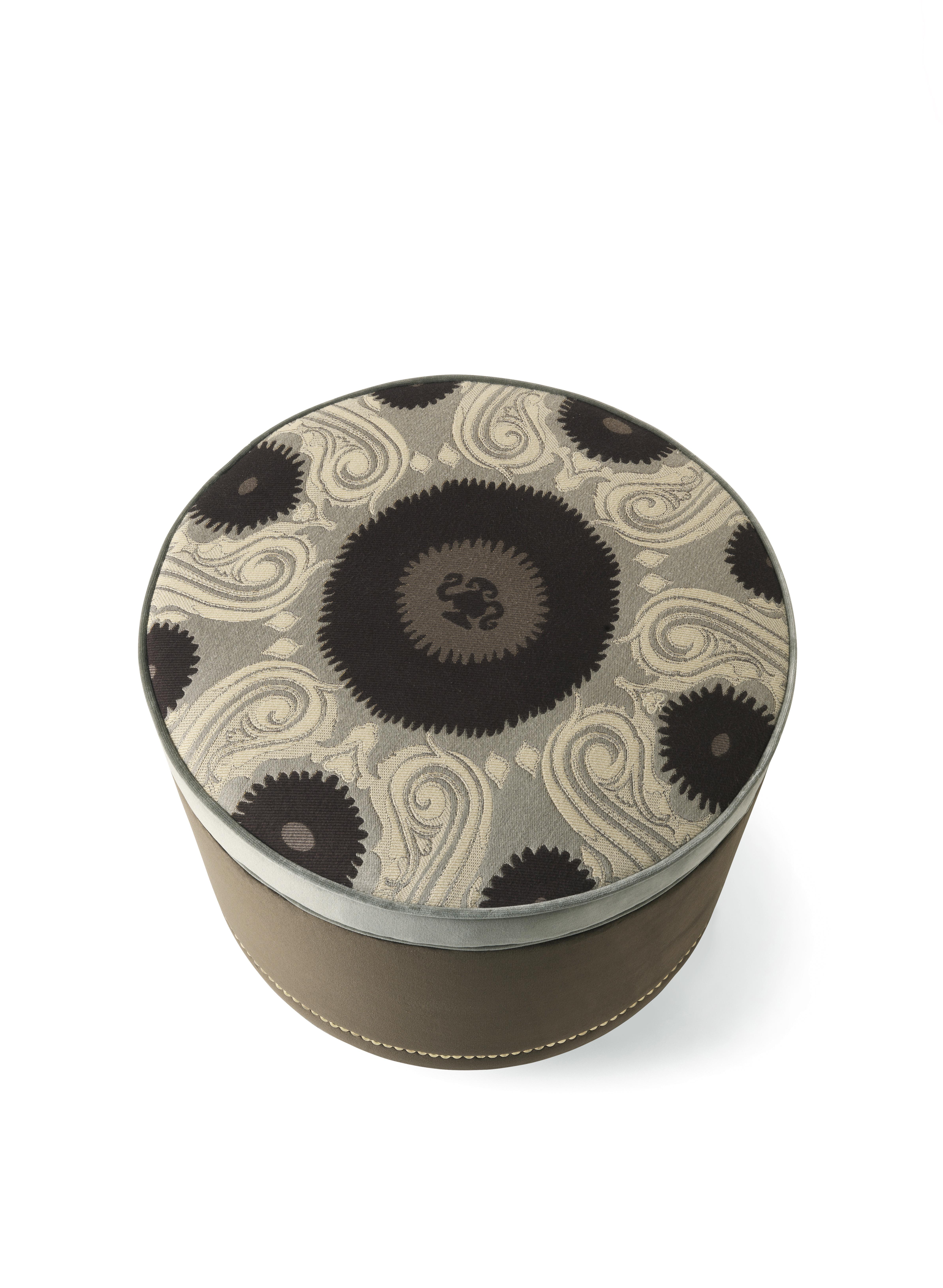 MERIAM Pouf with Structure in multilayer wood and variable thickness high-density polyurethane foam. 
Seat upholstery in jacquard fabric cat. A Bukhara col. 2 Smoke. Side upholstery in velvet cat. A Venezia col. 17 Moka. Upper edge upholstery and
