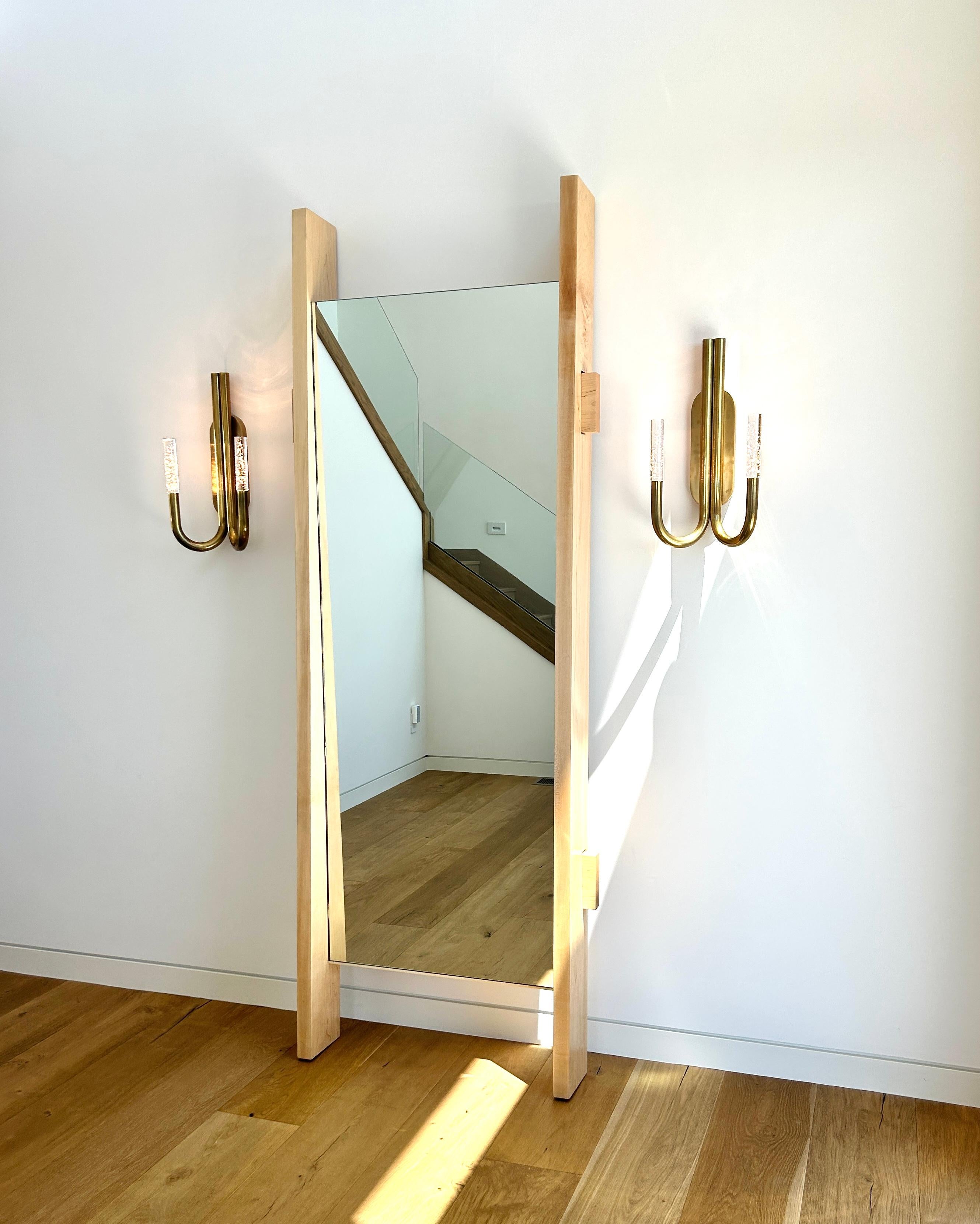 Welcome to Walker Design, where we specialize in crafting exquisite pieces that enhance the ambiance of your home. Introducing our 21st Century Minimalist Maple Foyer Mirror, a captivating entryway statement that exudes sophistication and