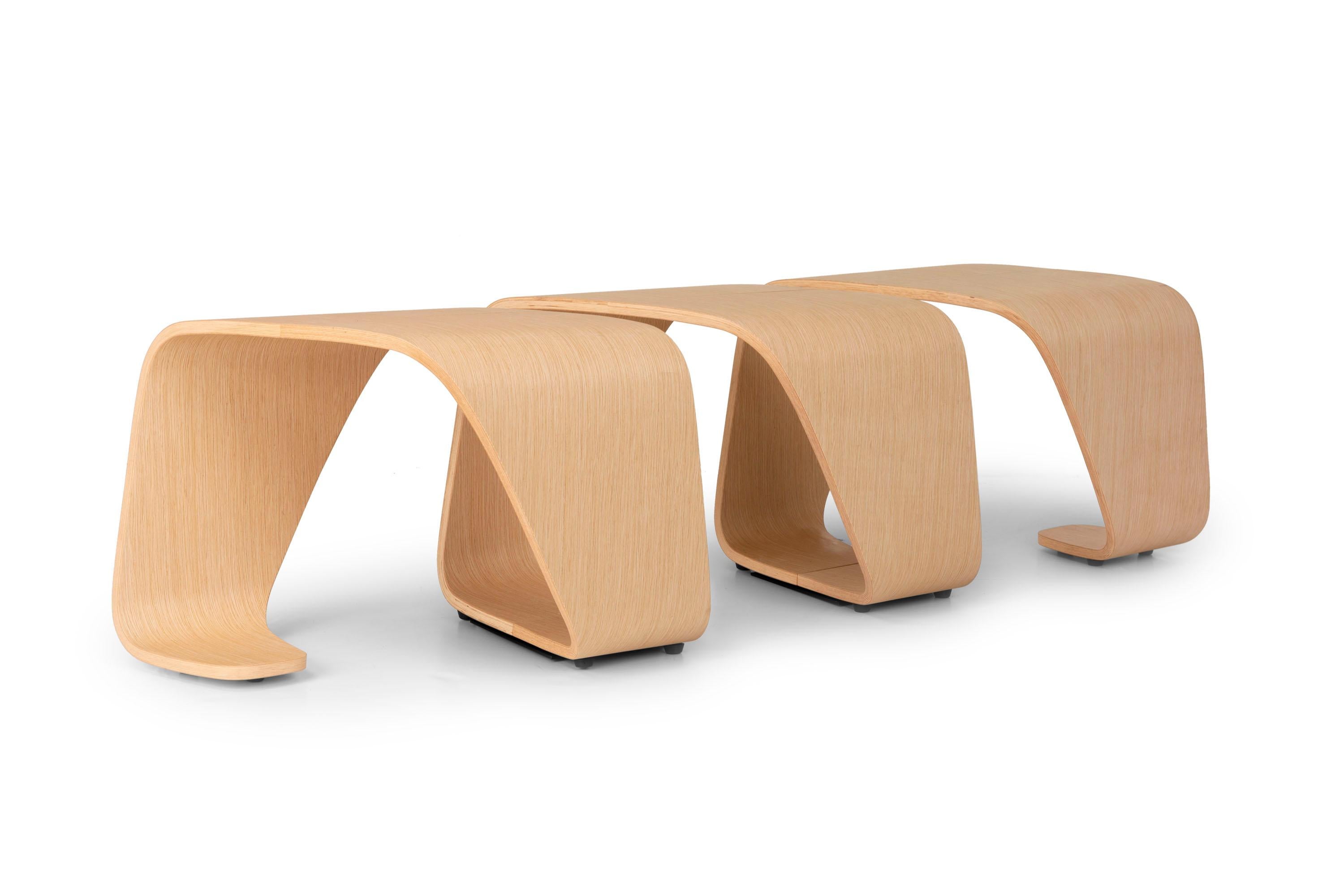Inspired by the dynamic forms of biogenetics, the DNA modular bench consists of a single element of curved wood plywood, assembled specularly. 
The result is an appealing piece of furniture with a particular helix shape, each step of which