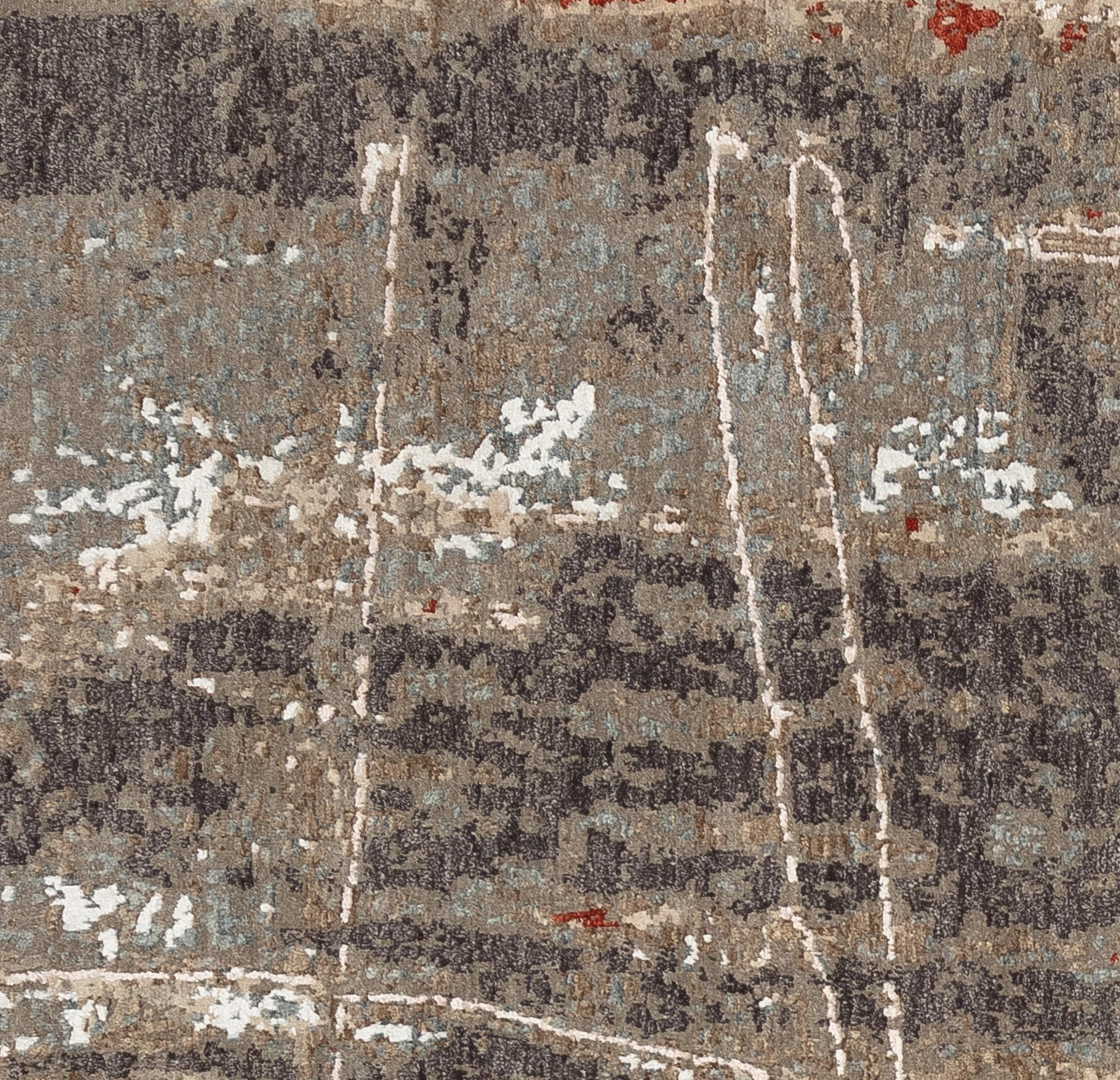 Questo tappeto contemporaneo brillante e audace presenta una palette di toni della terra davvero sorprendente. Dalle tonalità del castagno al beige e all'argento,  questo pezzo è di sicuro effetto. Splendidamente tessuta a mano in India con lana e