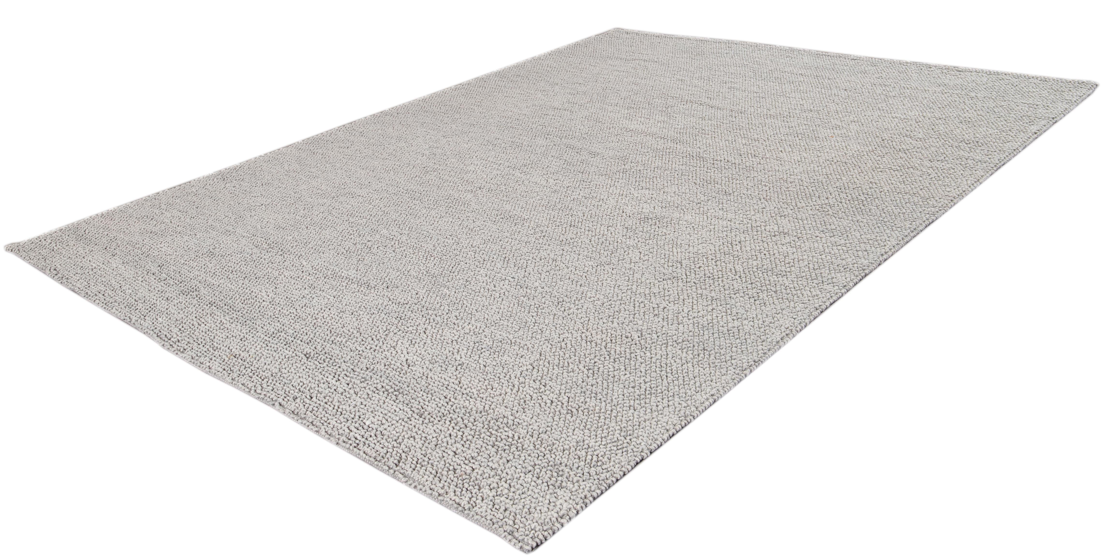 Beautiful Contemporary Textured rug, hand knotted wool with a solid gray color.

This rug measures 9' 0