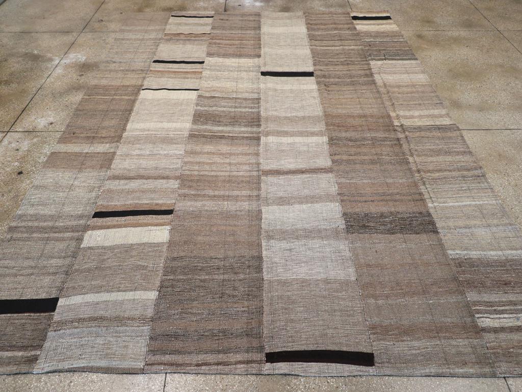 A modern Turkish flatweave Kilim room size carpet handmade during the 21st century.

Measures: 9' 7