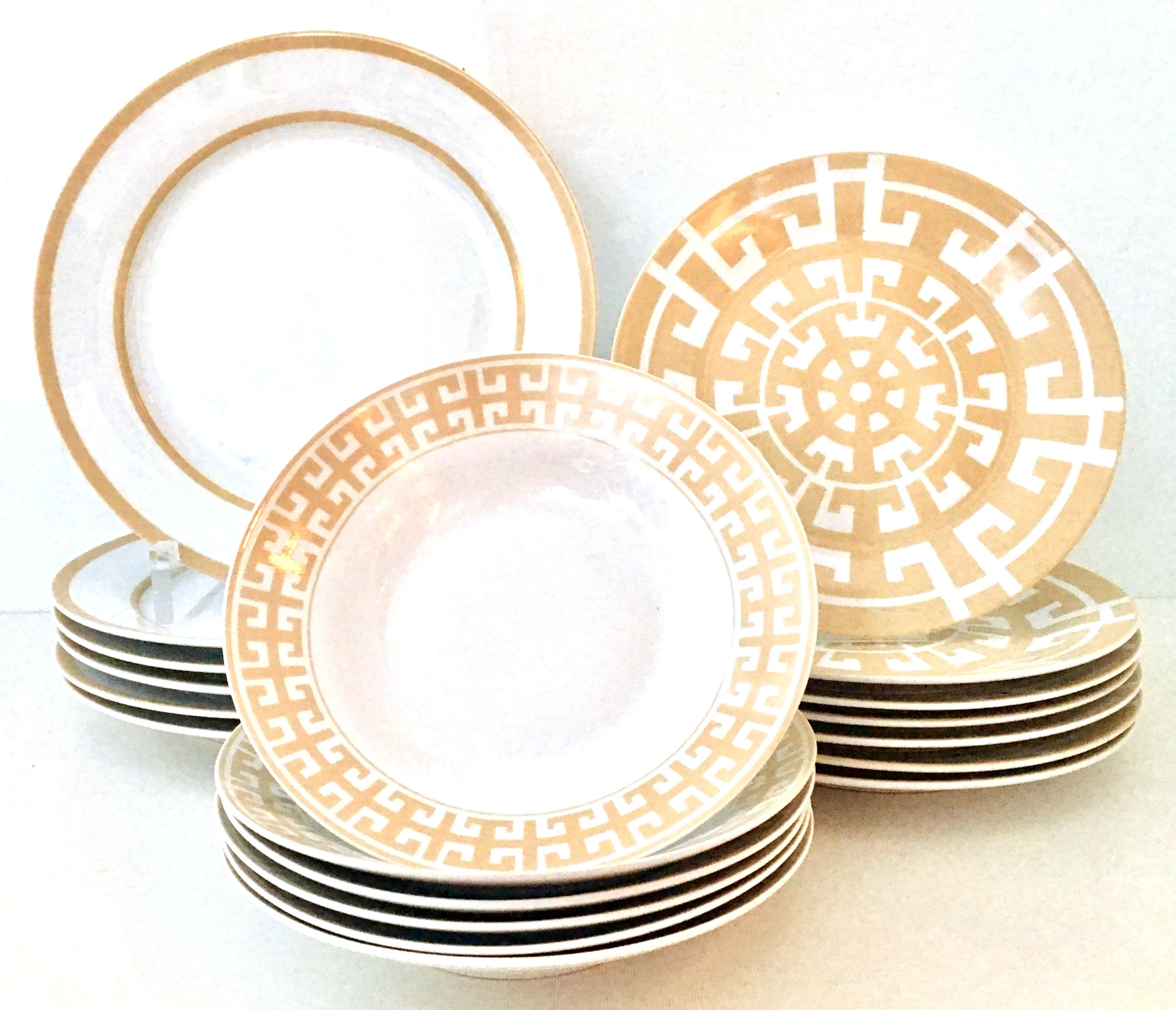 21st century and new modern Hermes style geometric ceramic dinnerware by, Colin Cowie.. This 21 piece set features a different camel and white color hue motif on each of the three pieces and includes, seven dinner plates, seven soup or cereal bowls