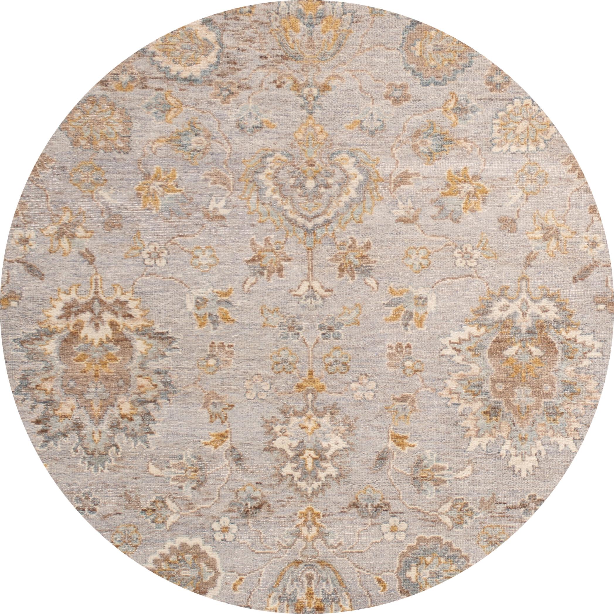 Beautiful contemporary Indian rug, hand knotted wool, with a light gray field, tan and ivory accents in an all-over Classic motif, circa 2019.
This rug measures 4' 2