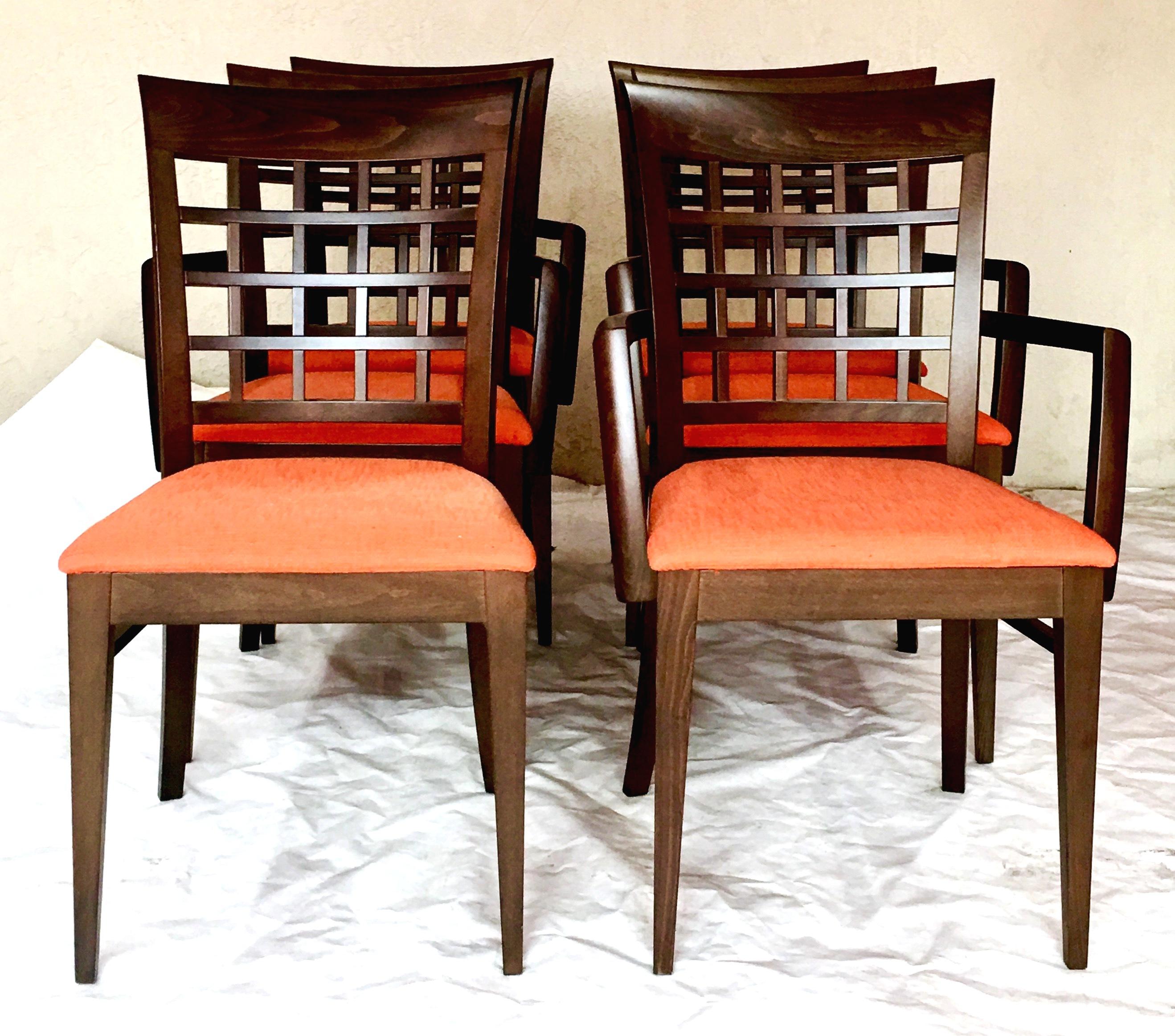 21st Century Contemporary & Modern upholstered dining chairs By,  Roche Bobois. Features a dark mahogany stain wood frame with an orange linen blend upholstery fabric.
These like new, never used,  contemporary set of six chairs includes two slipper