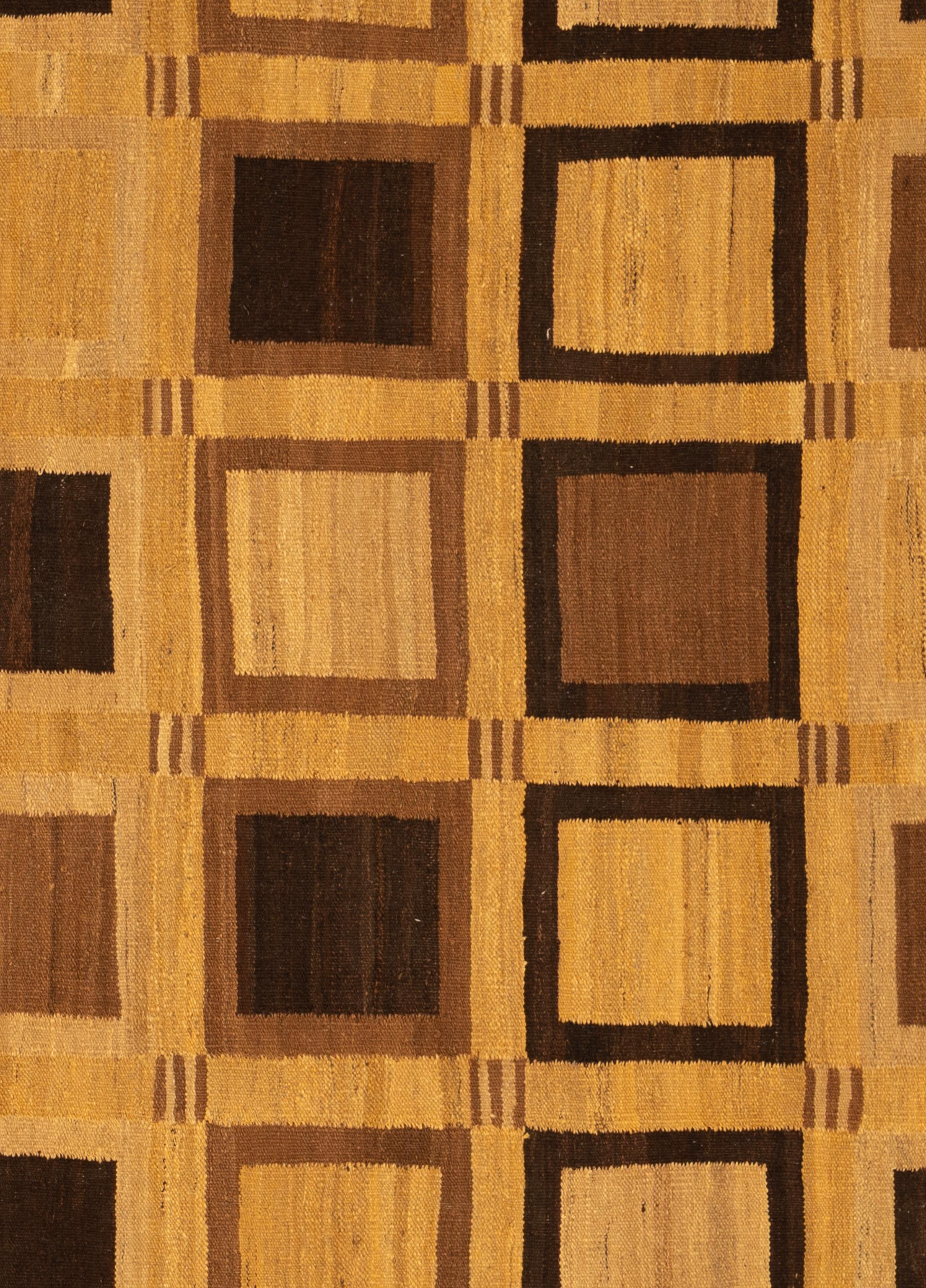 Bold, flatwoven, and effortlessly stylish, this modern kilim rug brings a fresh perspective to a time-honored weaving tradition. Handcrafted using 100% wool, the rug features a low-profile, lightweight construction with the crisp geometry and