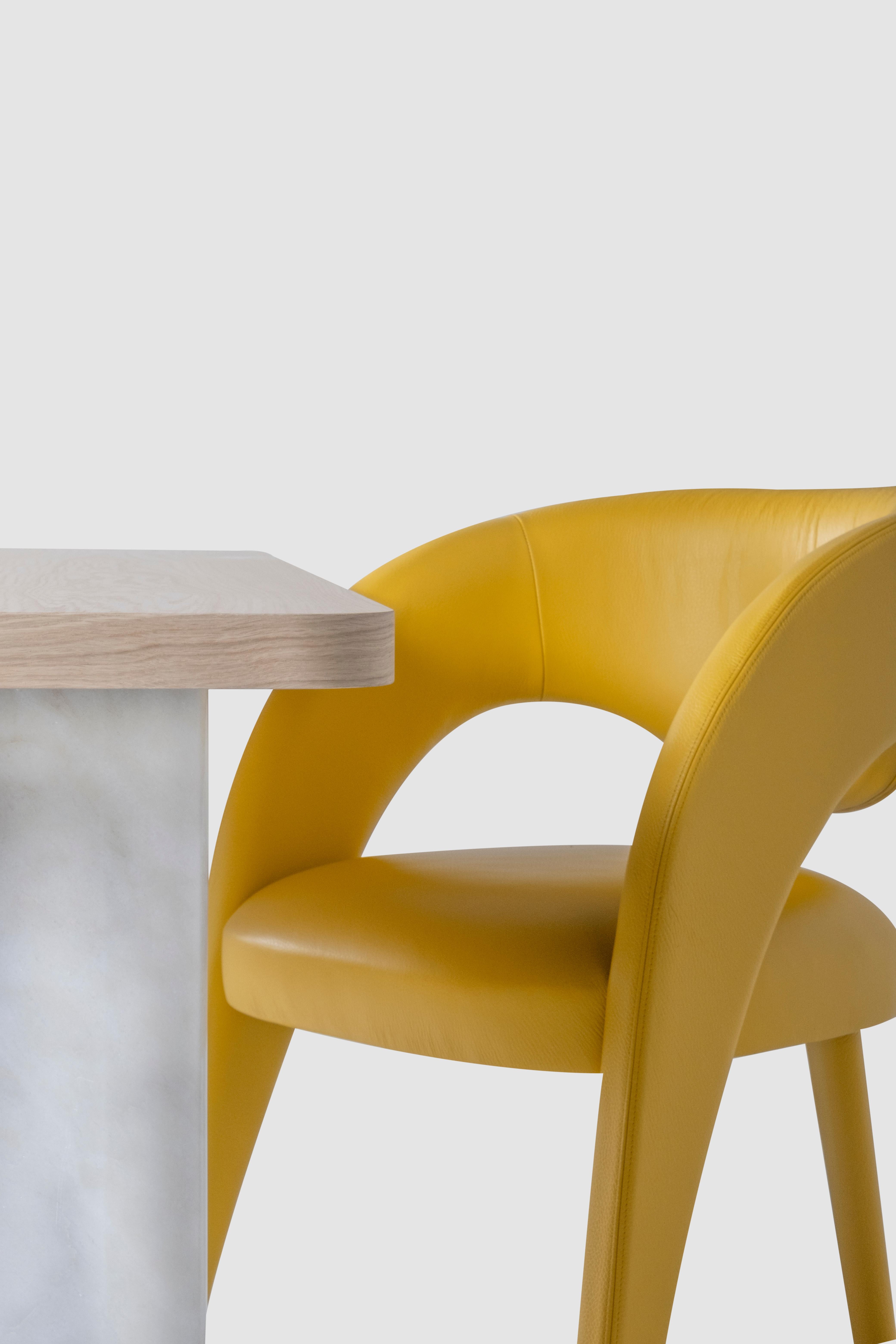 Laurence Chair, Contemporary Collection, Handcrafted in Portugal - Europe by Greenapple.

The Laurence leather dining chair is an artistic tribute to the essence of femininity in contemporary design. With its elegant and daring silhouette, this