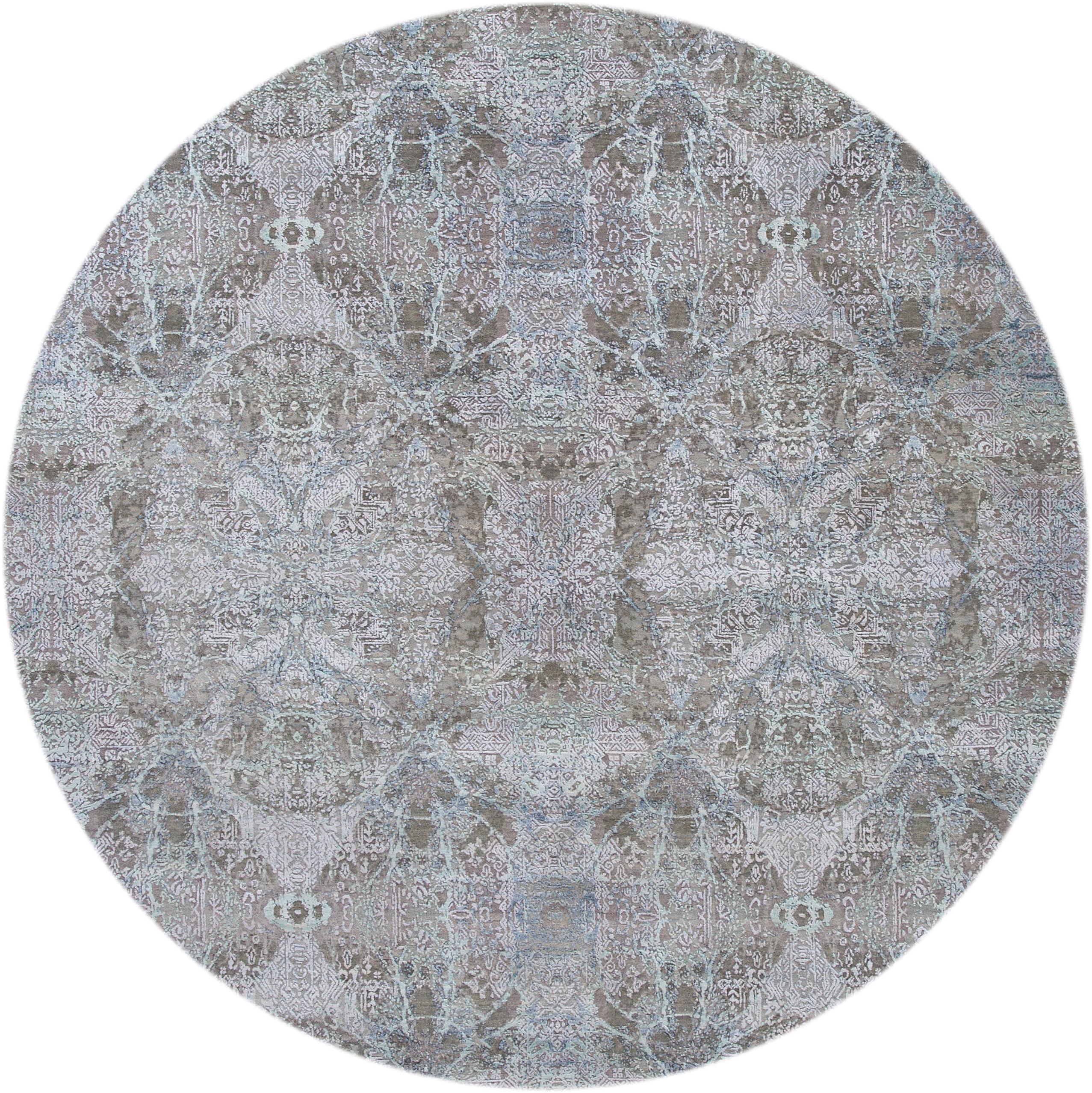 Beautiful contemporary Indian Tabriz rug, hand knotted wool and silk in a gray field, ivory and blue accents in a Classic motif, circa 2019.
This rug measures 8' 11