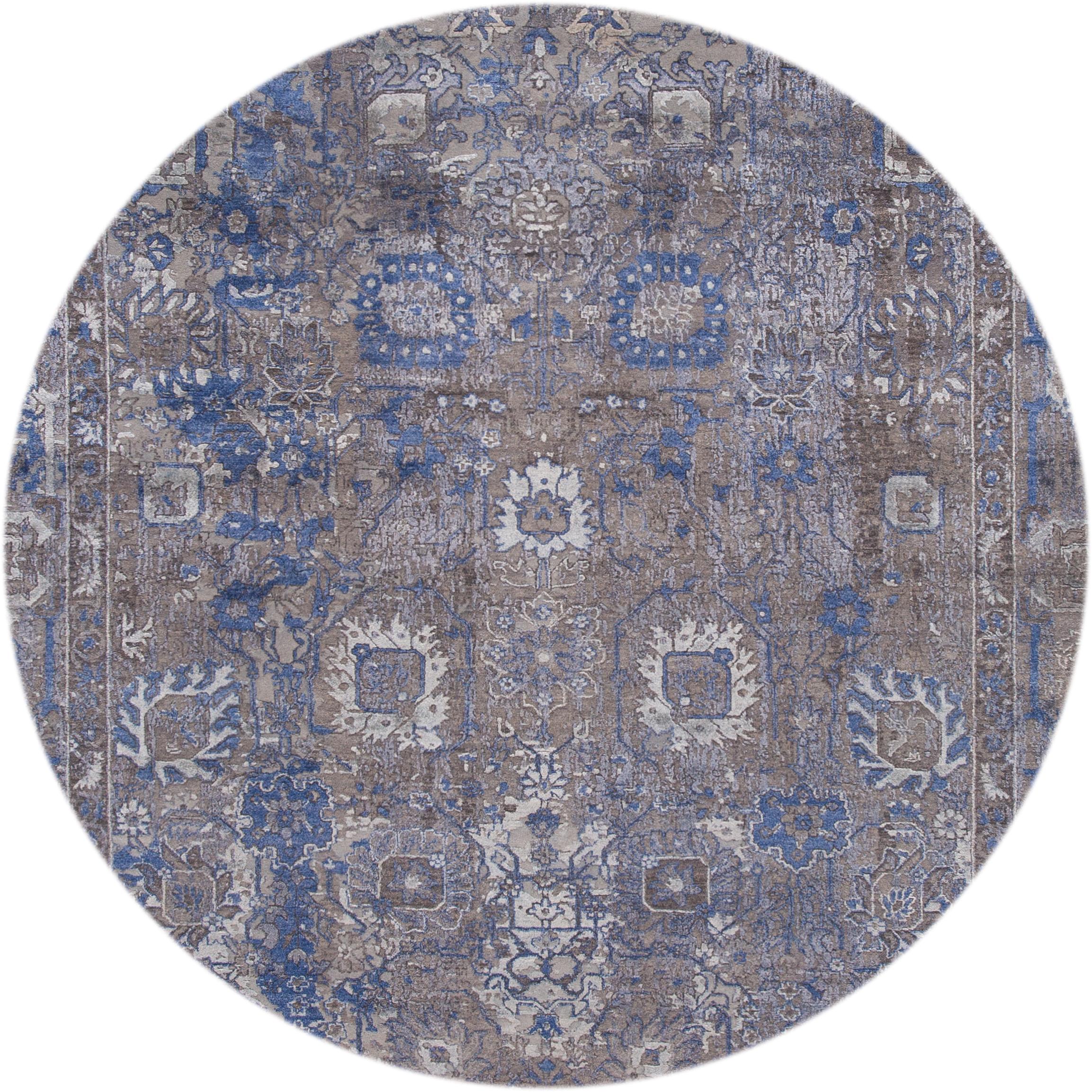 Beautiful contemporary Indian, hand knotted wool and silk in a gray field, ivory and blue accents in a Classic motif.
This rug measures 8' 11