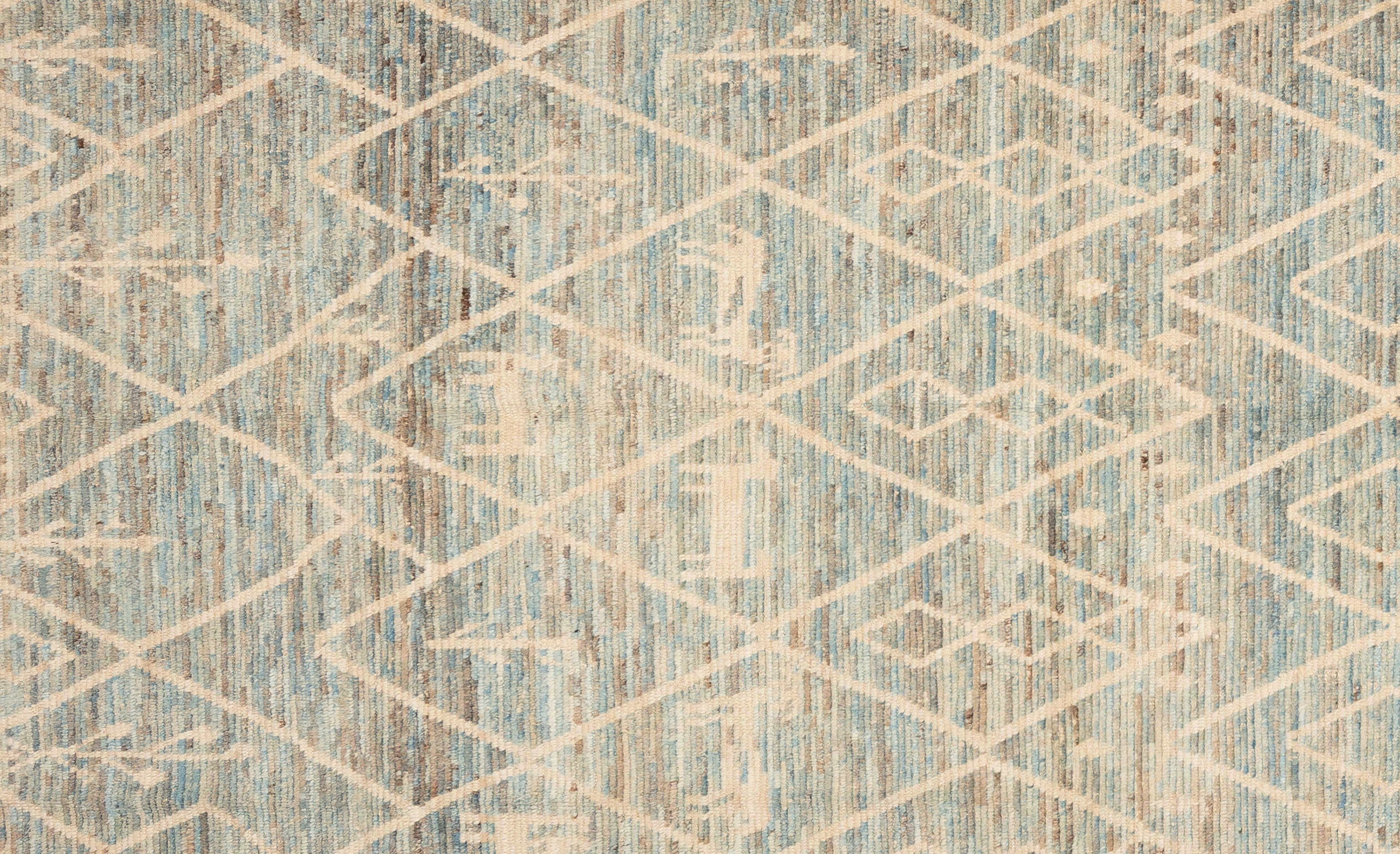 Handwoven with 100% handspun wool, in the subtropical woodlands of Pakistan; this beautiful naturally dyed Moroccan rug is truly one-of-a-kind. Moroccan rugs tend to be simple and are the perfect compliment for your décor. From minimalist modern to