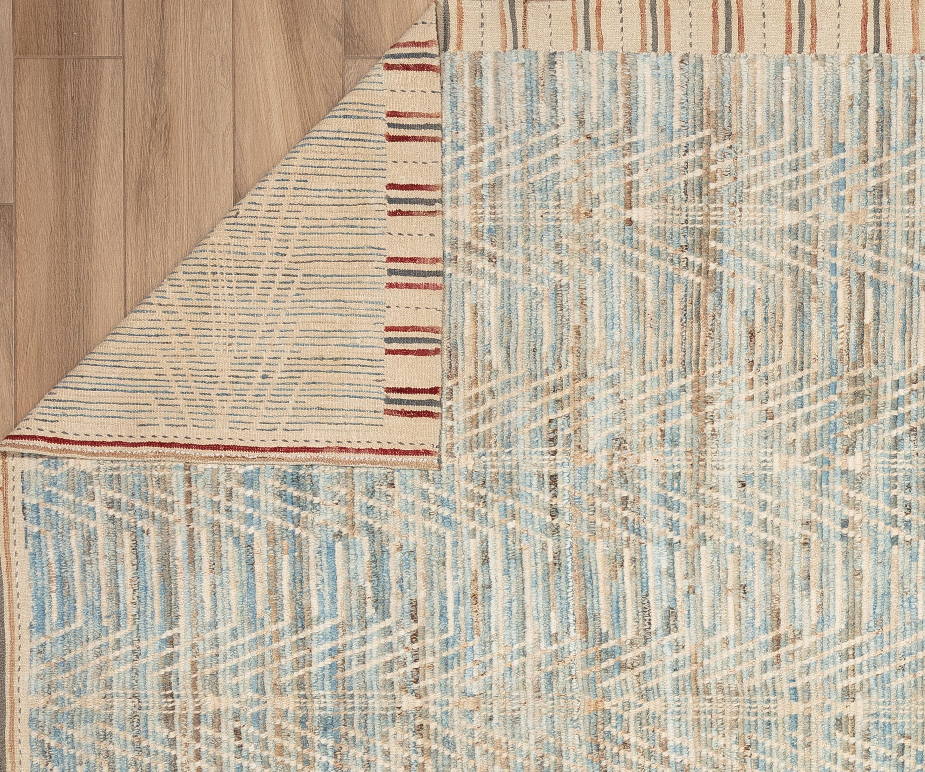 Handwoven with 100% handspun wool, in the subtropical woodlands of Pakistan; this beautiful naturally dyed Moroccan rug is truly one-of-a-kind. Moroccan rugs tend to be simple and are the perfect compliment for your décor. From minimalist modern to