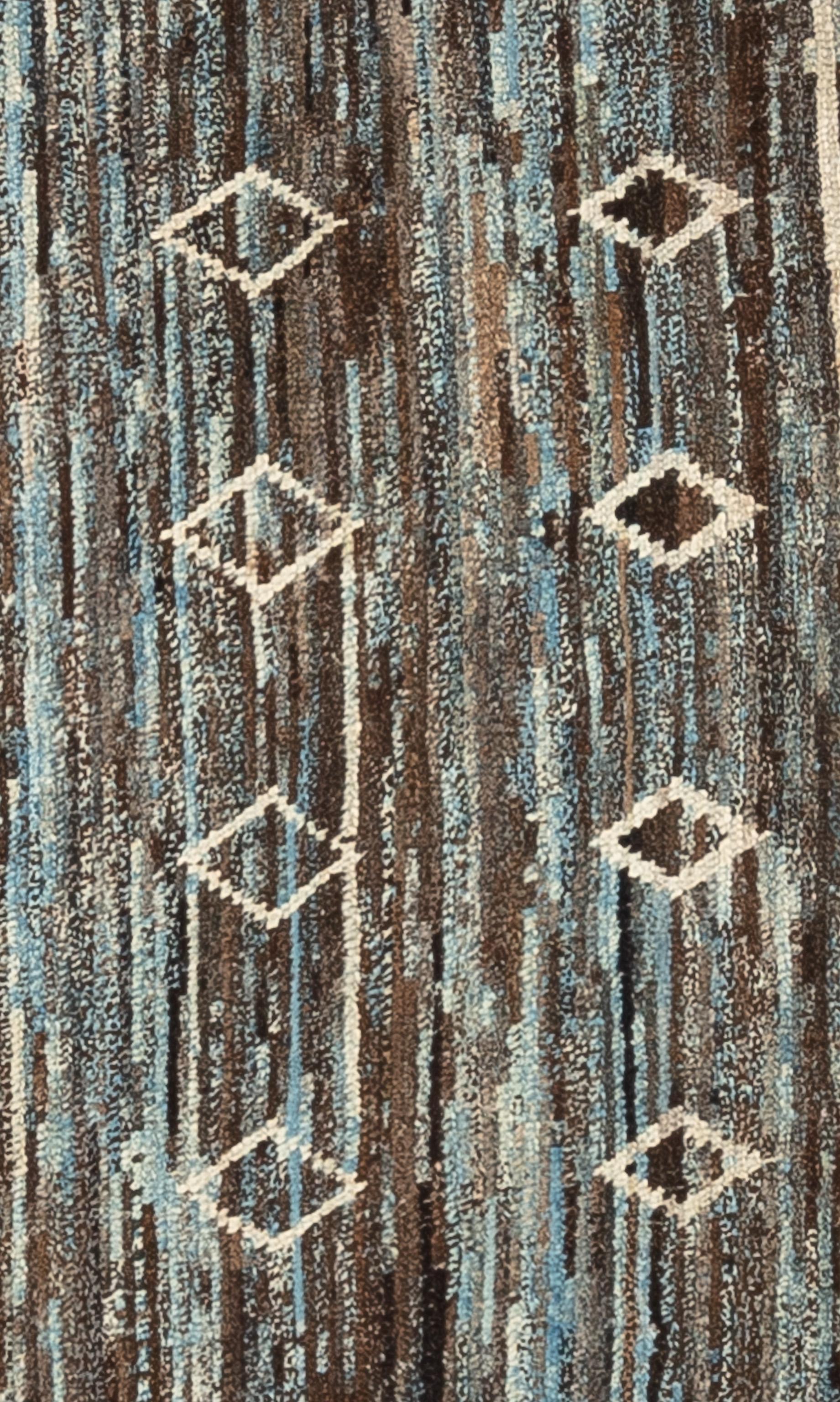 Handwoven with 100% handspun wool, in the mountains of Afghanistan; this beautiful naturally dyed Moroccan rug is truly one-of-a-kind. Moroccan rugs tend to be simple and are the perfect compliment for your décor. From minimalist modern to