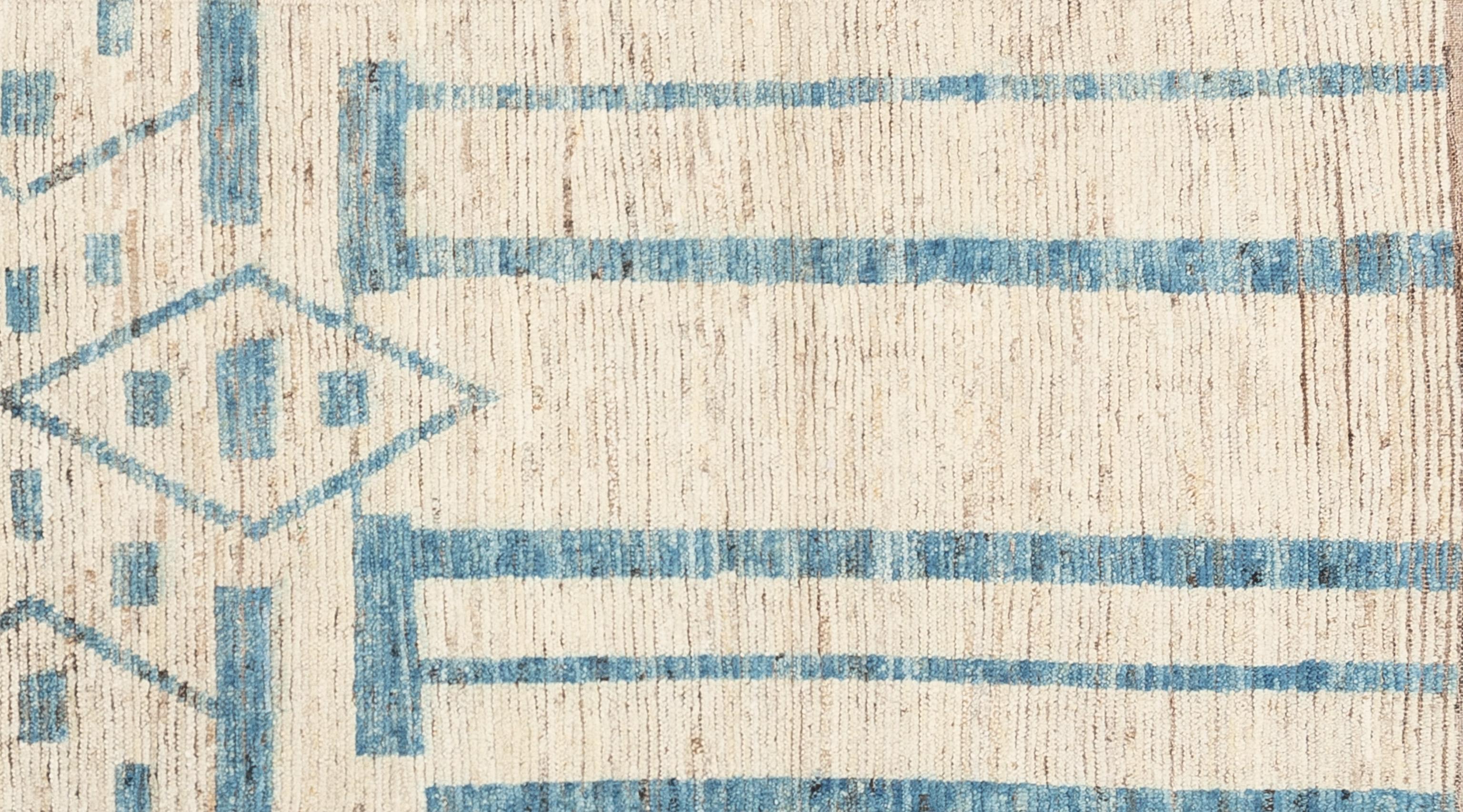 Handwoven with 100% handspun wool, in the mountains of Afghanistan; this beautiful naturally dyed Moroccan rug is truly one-of-a-kind. Moroccan rugs tend to be simple and are the perfect compliment for your décor. From minimalist modern to