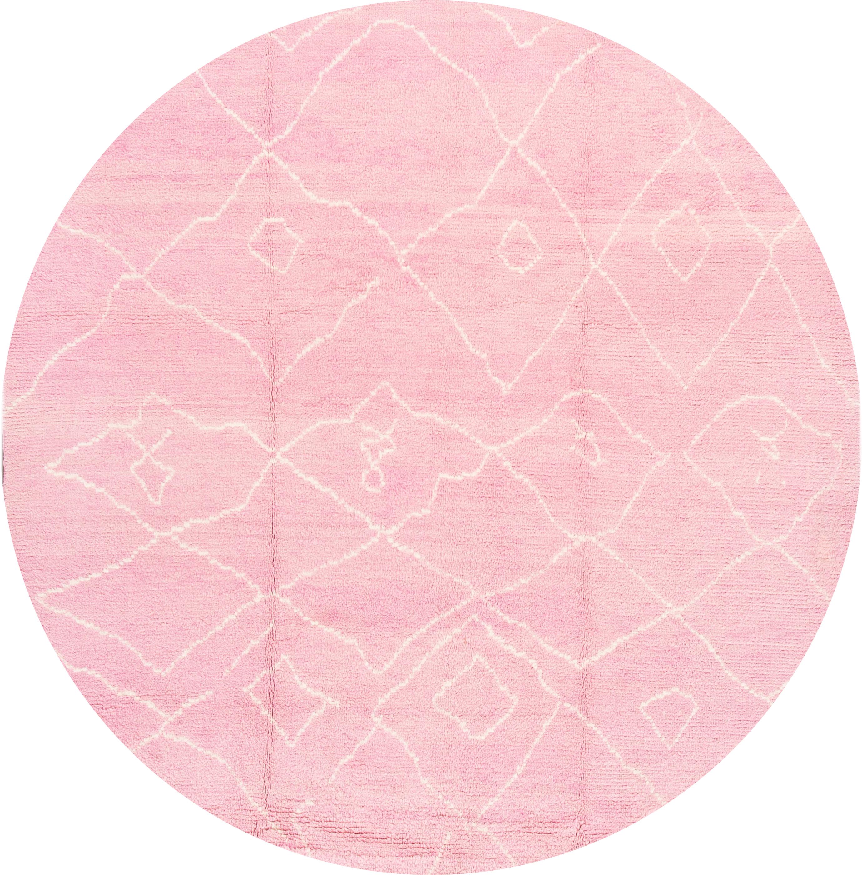 Beautiful Moroccan style Turkish rug, hand knotted wool with a pink field, white field in a gorgeous all-over geometric tribal design.

This rug measures: 8'3