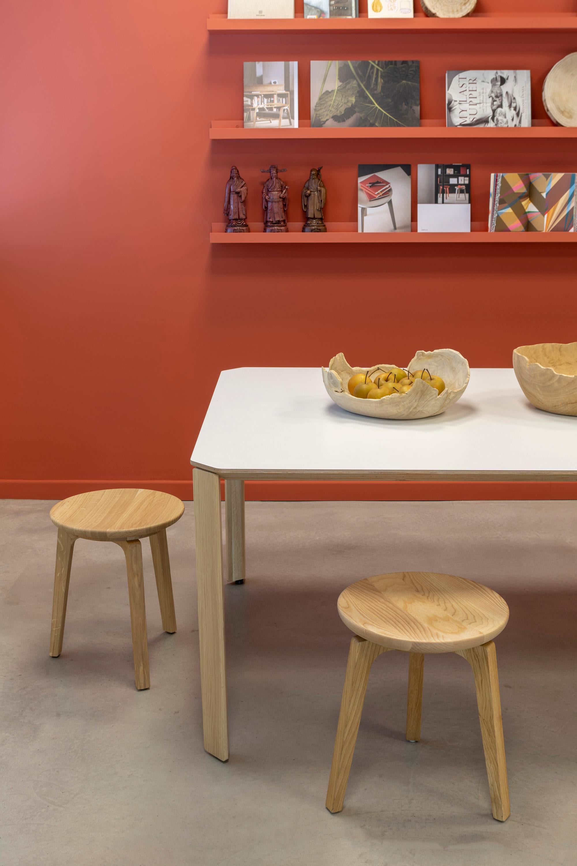 Inspired by the traditional work stools, TOD is available in two different heights.
Made of solid wood, it is proposed not only in natural oak or thermocooked wood, but also in a variety of colours with a glossy finish that make it a transversal