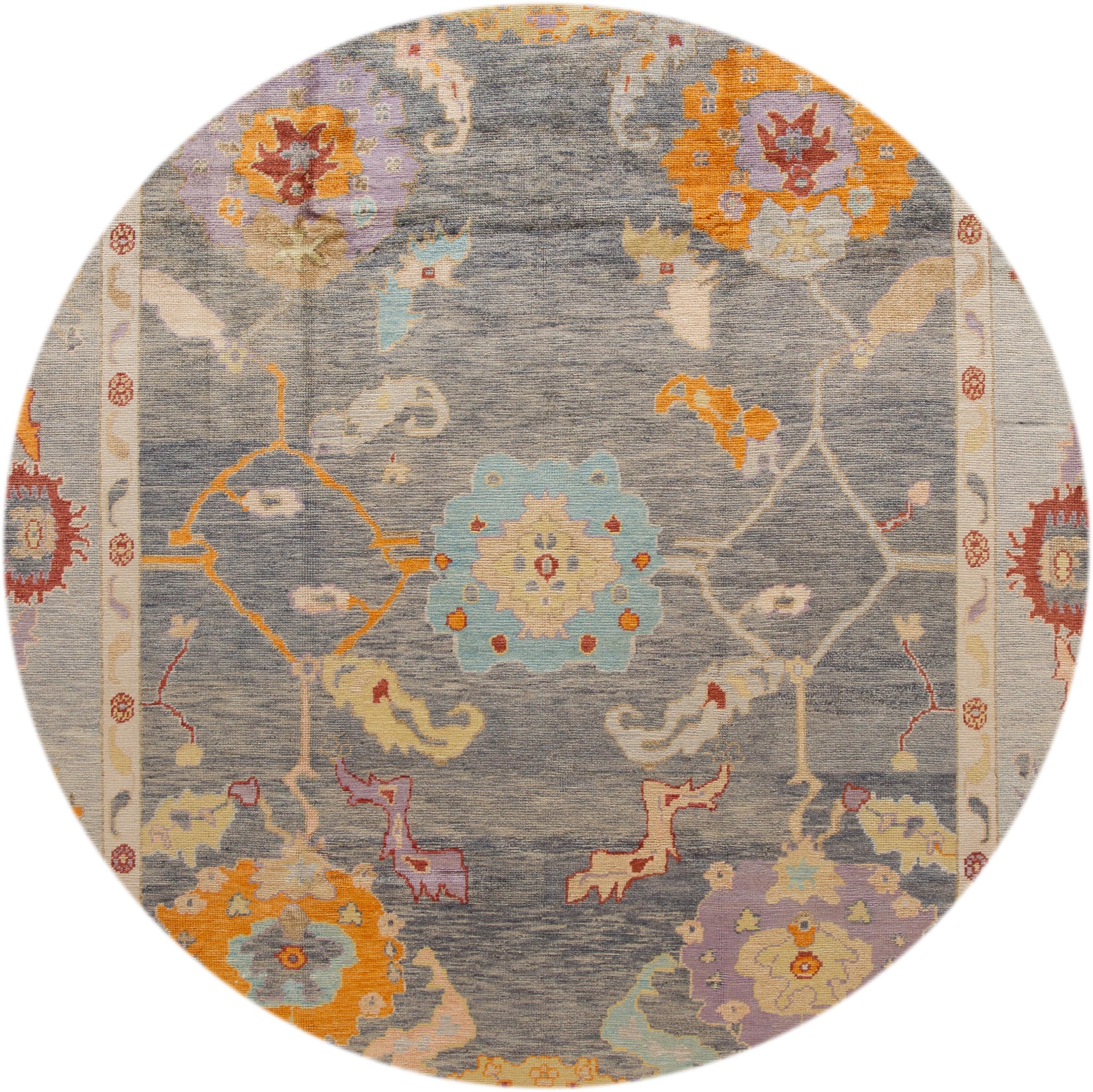 Beautiful contemporary Turkish Oushak rug, hand knotted wool with a gray field, multi-color accents in a multi medallion design.
This rug measures: 10'4