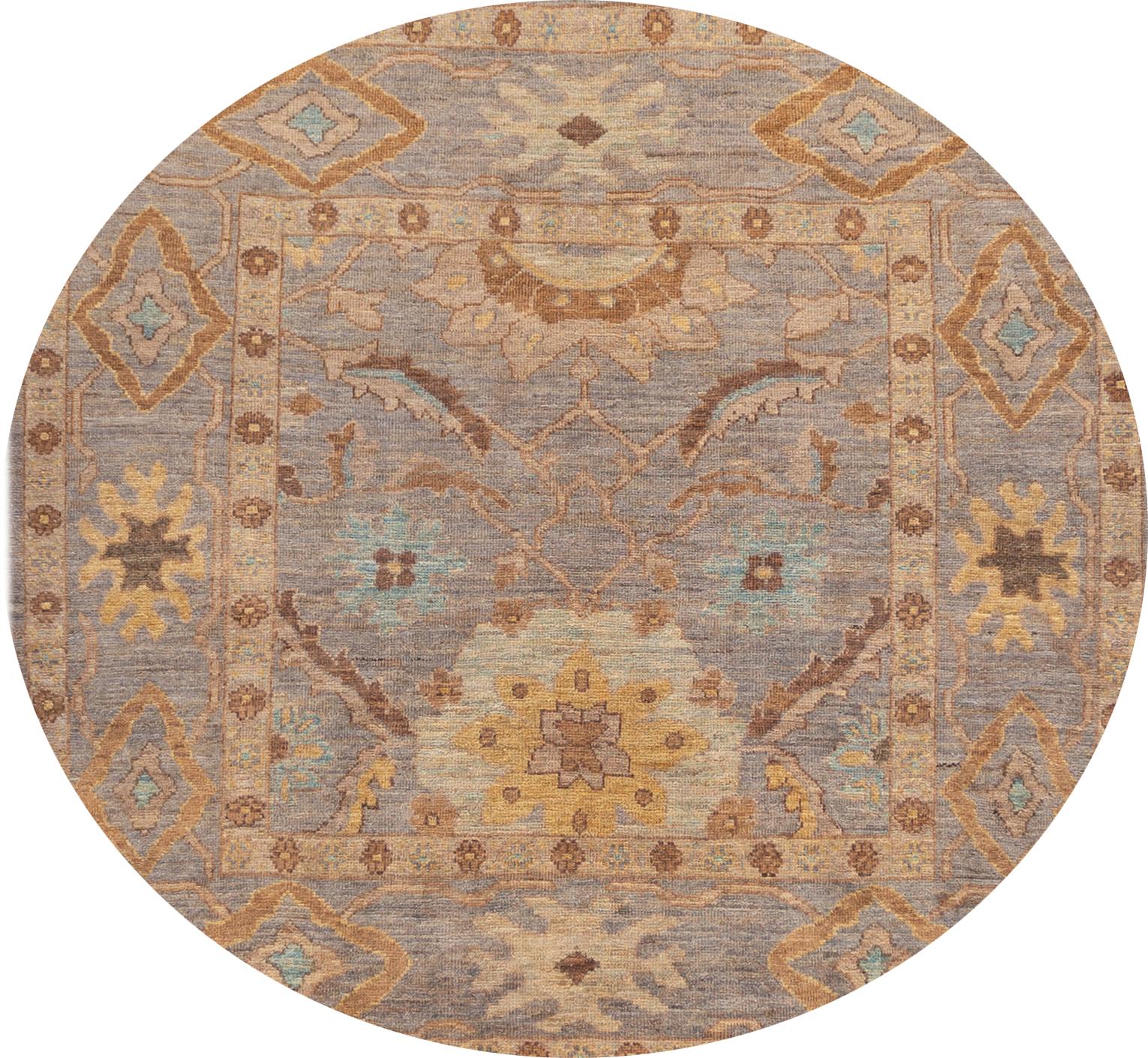 A beautiful 21st century modern Persian square Sultanabad, hand knotted rug with a brown motif and a purple field. This collection is of wool and made in Iran. 

This rug measures: 6' x 6'3