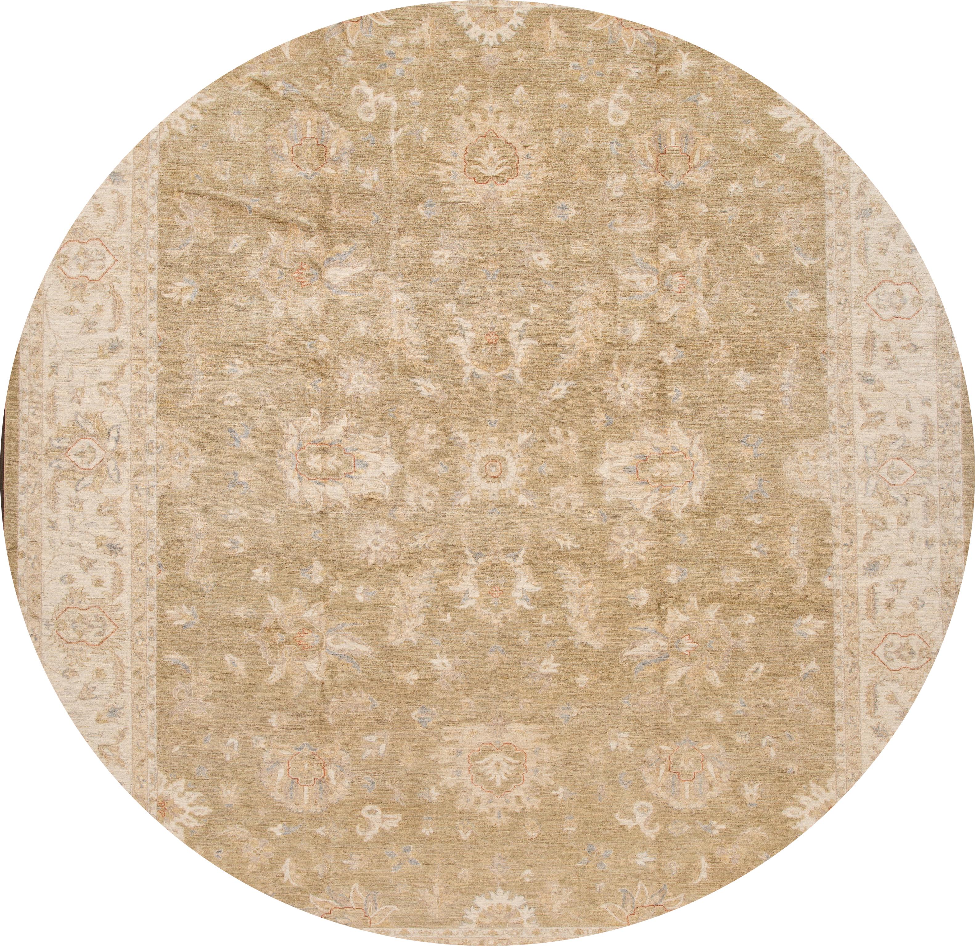 A beautiful modern Peshawar wool rug with a tan field, and an ivory accents in an all-over floral design.

Tgis rug measures: 11' 9'' x 14' 8''.
 