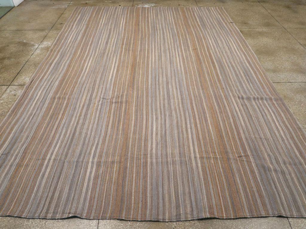 A modern rustic Turkish flatweave Kilim room size carpet handmade during the 21st century.

Measures: 10' 8