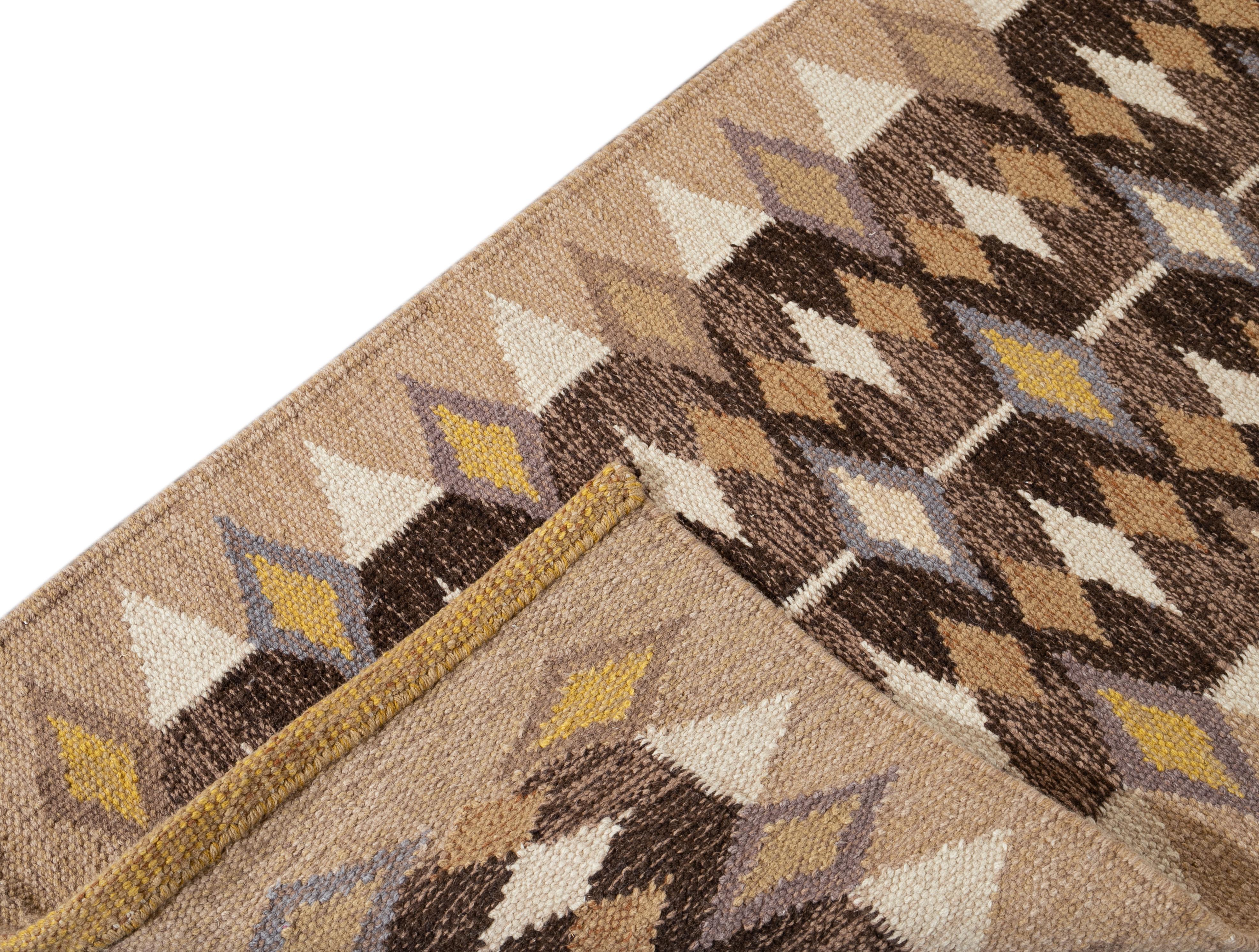 A 21st century modern Scandinavian-style flat-weave runner rug with a chocolate field and tan accents in an allover geometric design. This rug measures 2'9