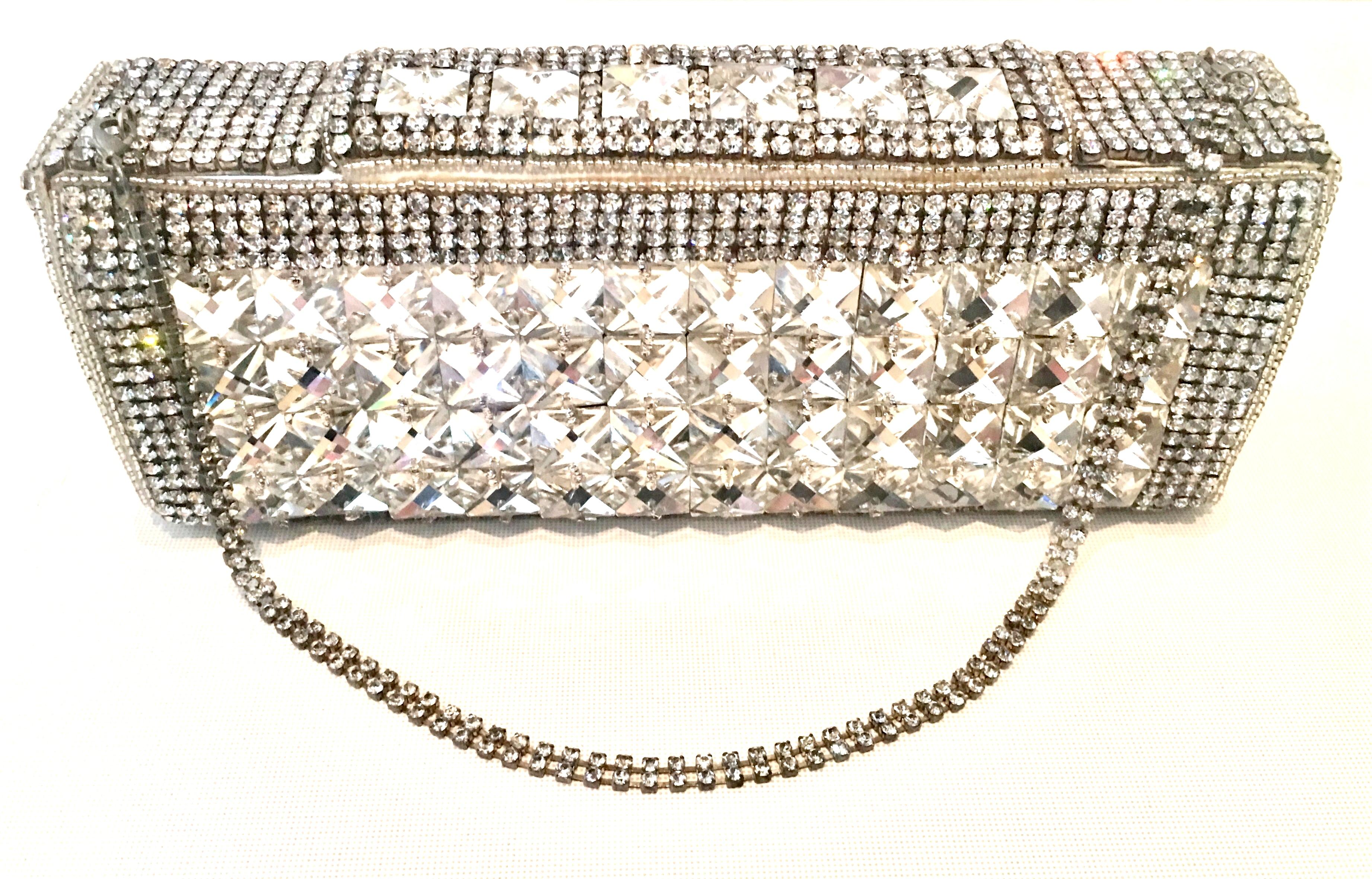 Contemporary & New Hand Crafted Silver Metallic Swarovski Crystal Clear Rhinestone Embellished Evening Bag By, Bougainvillea. This hand crafted box style hand bag features a silver metallic leather base fully encrusted with hand applied crystal