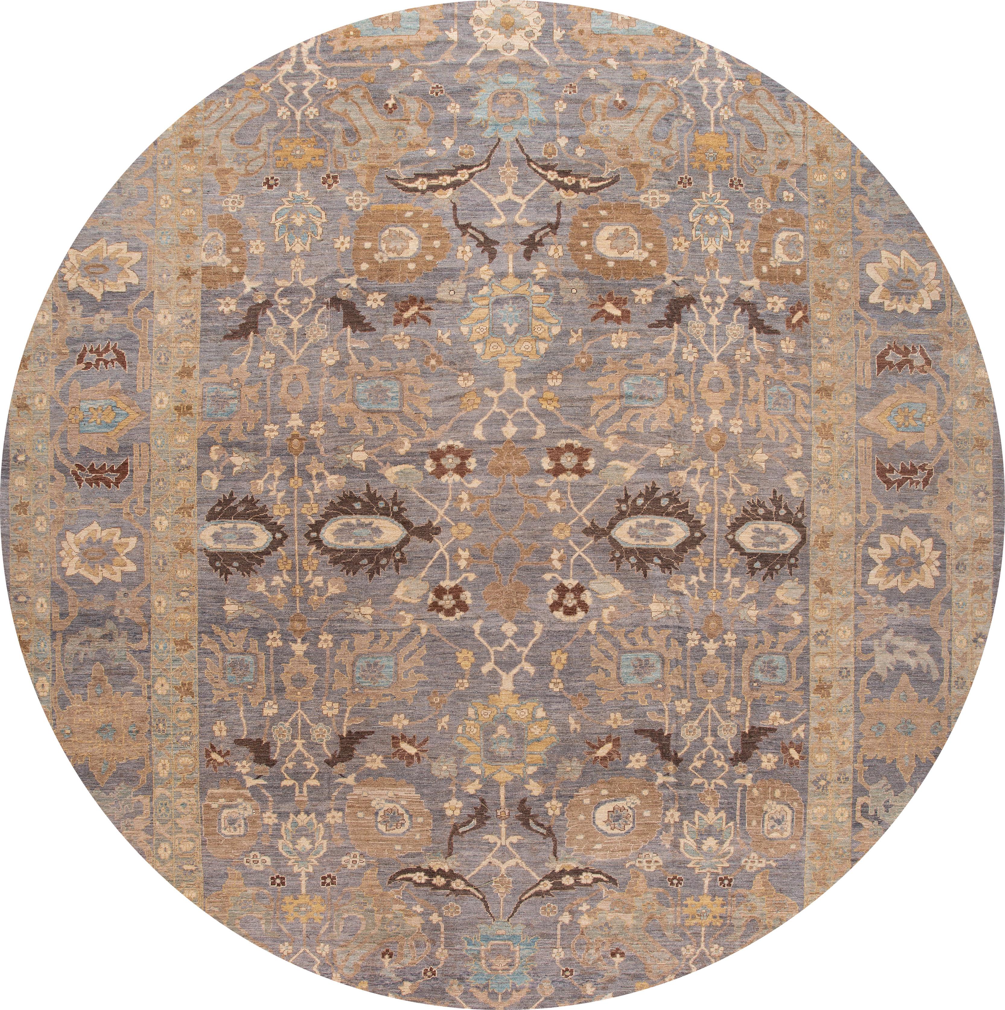 Beautiful Sultanabad rug with a gray field and beige accents with an all-over floral design. 

This rug measures 14' 8