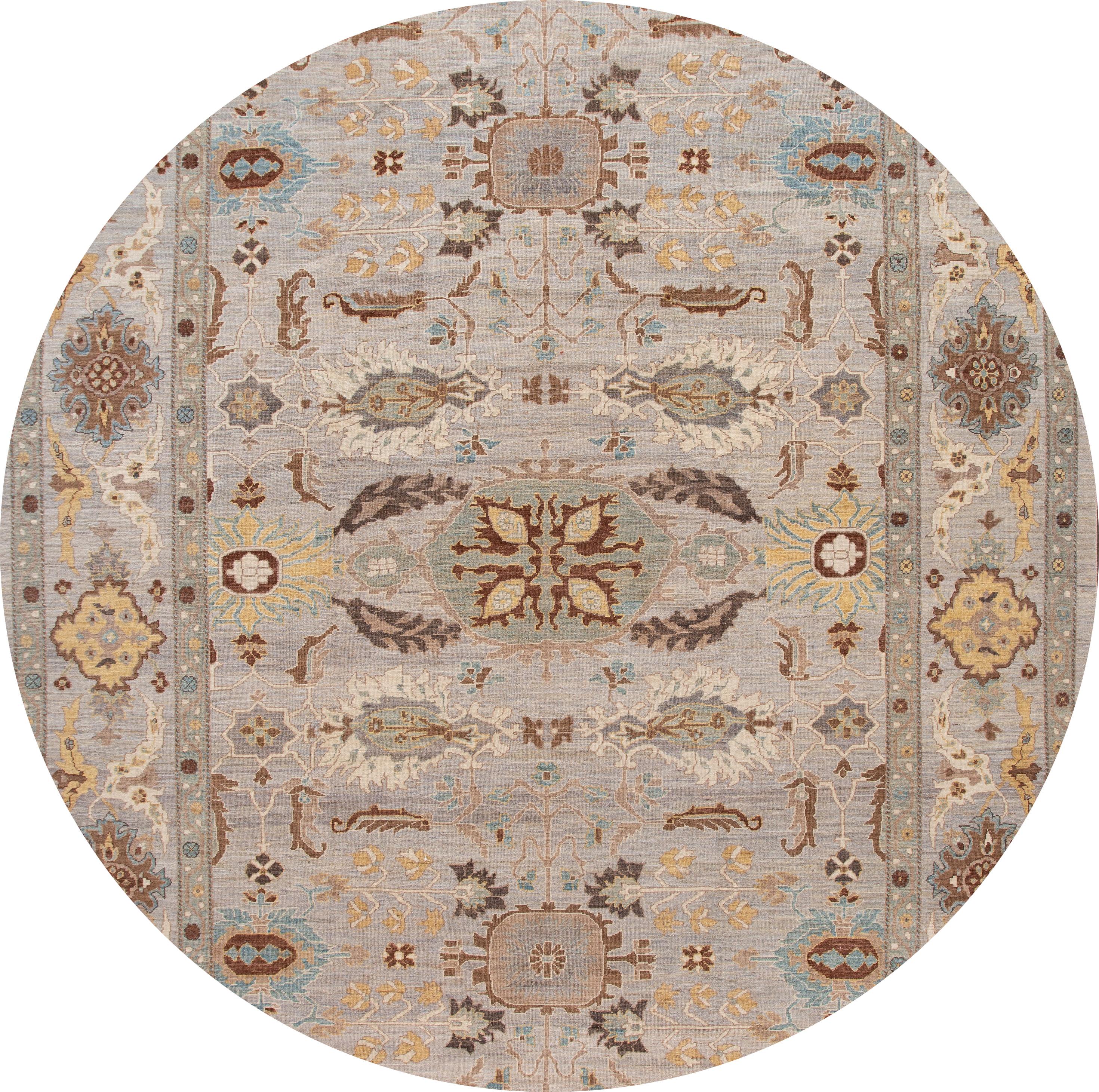 A beautiful hand knotted modern Sultanabad oversize wool rug with a gray field, and brown accents in an all-over floral design.

This rug measures: 12'10