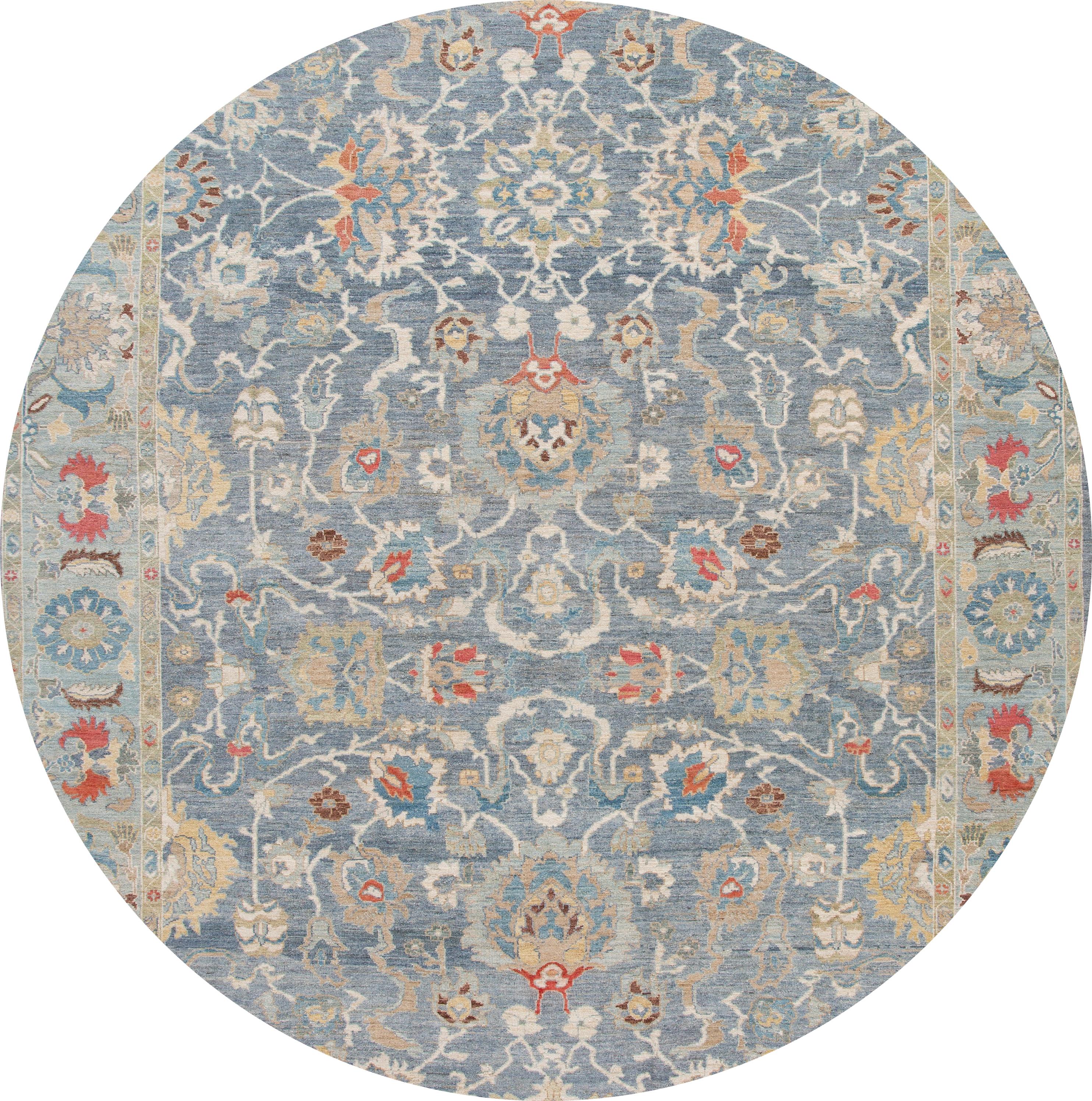 Beautiful contemporary oversize Sultanabad rug, hand knotted wool with a blue field, green frame, multi-color accents in all-over Classic floral medallion design.

This rug measures: 12'2