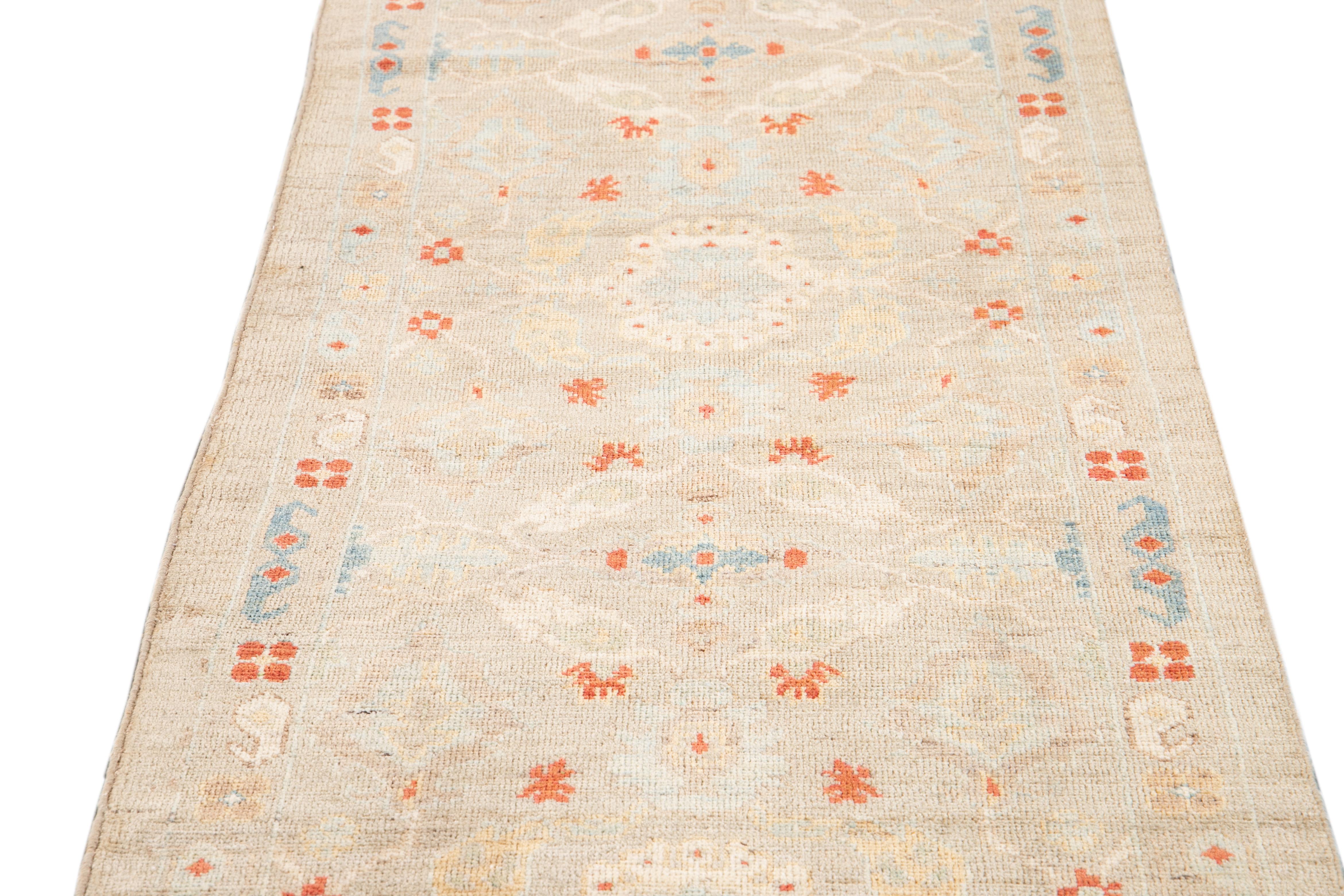 Beautiful contemporary Sultanabad runner rug, hand knotted wool with an tan field, orange and light blue accents all-over the design.
This rug measures 3' 1