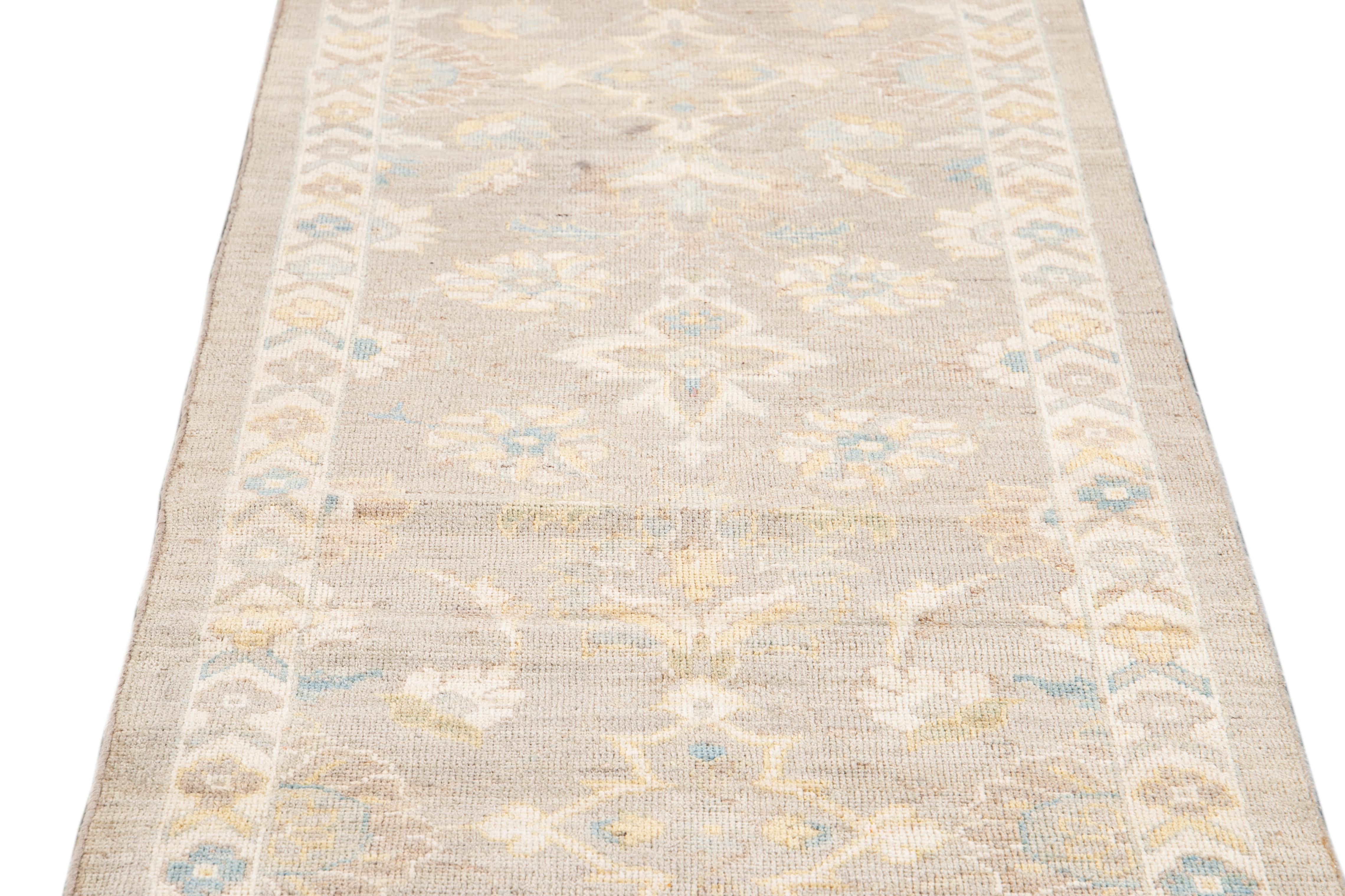 Beautiful contemporary Sultanabad runner rug, hand-knotted wool with a gray and beige field and multi-color accents all-over floral design.

This rug measures 3'01
