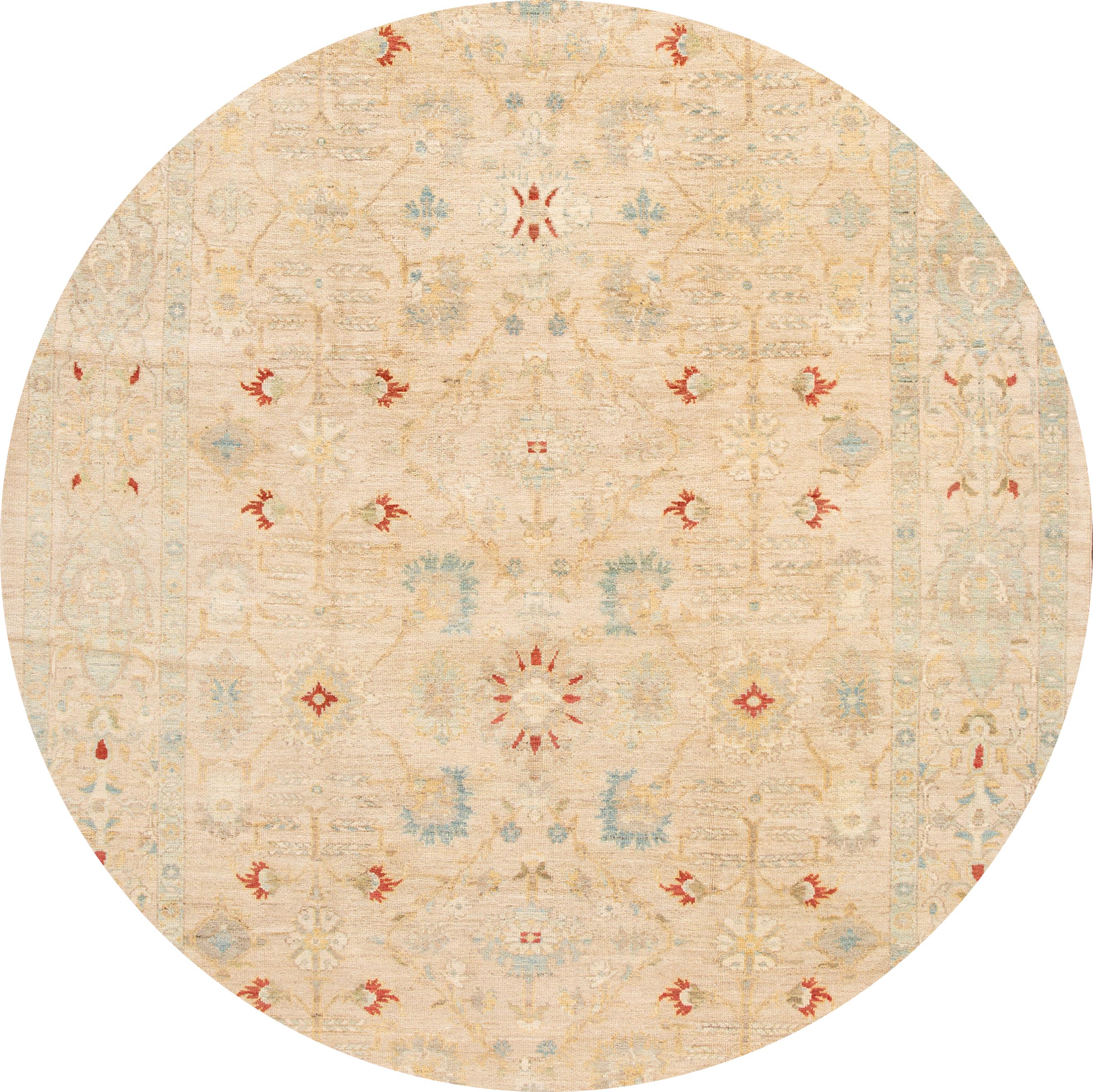 Beautiful contemporary Persian Sultanabad rug, hand-knotted wool with a tan field, blue, red and ivory accents all over the design, 
This rug measures 8' 8