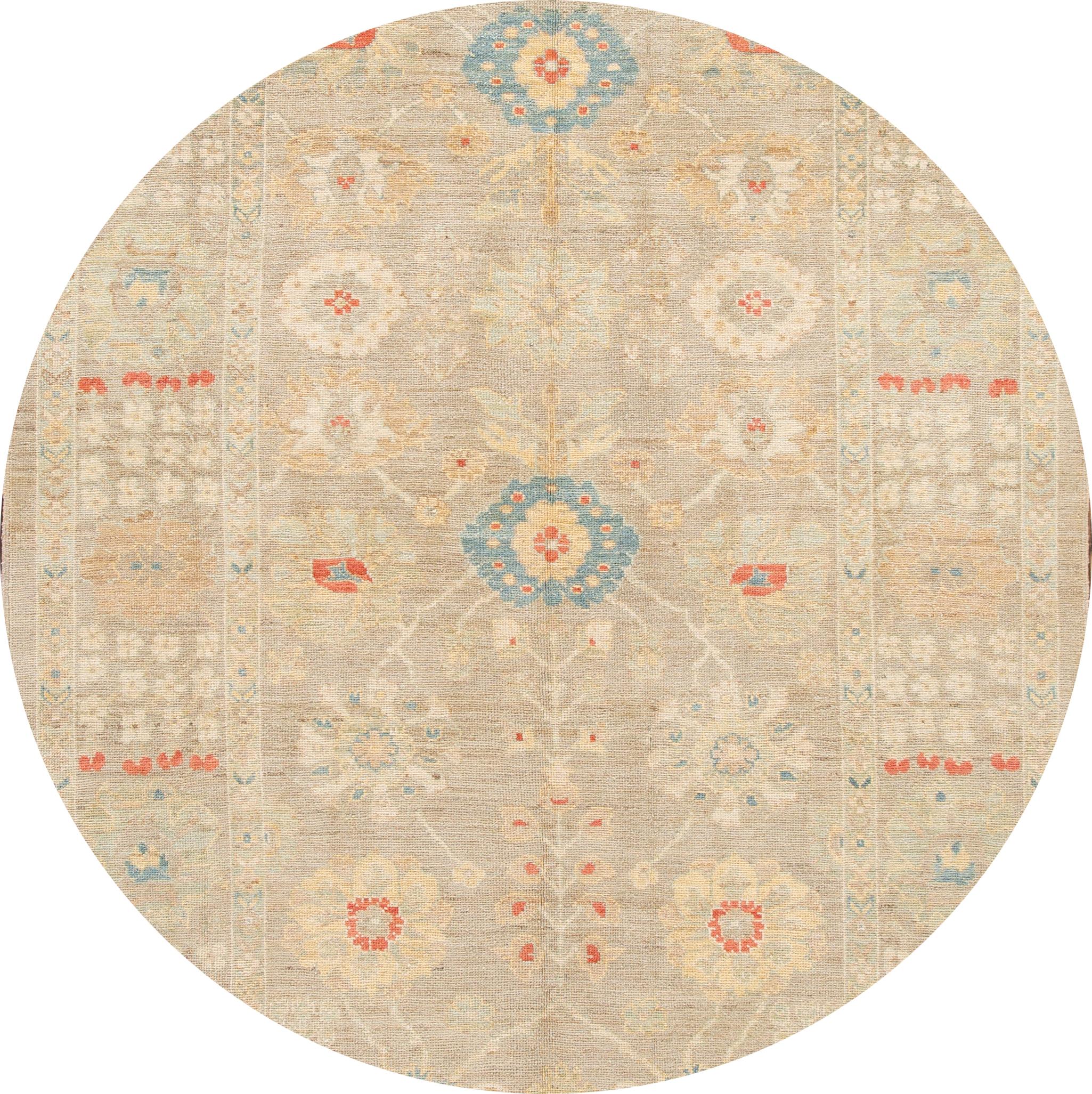 Beautiful contemporary  Sultanabad rug, hand-knotted wool with a tan field, blue, red and ivory accents,
This rug measures: 6' 08