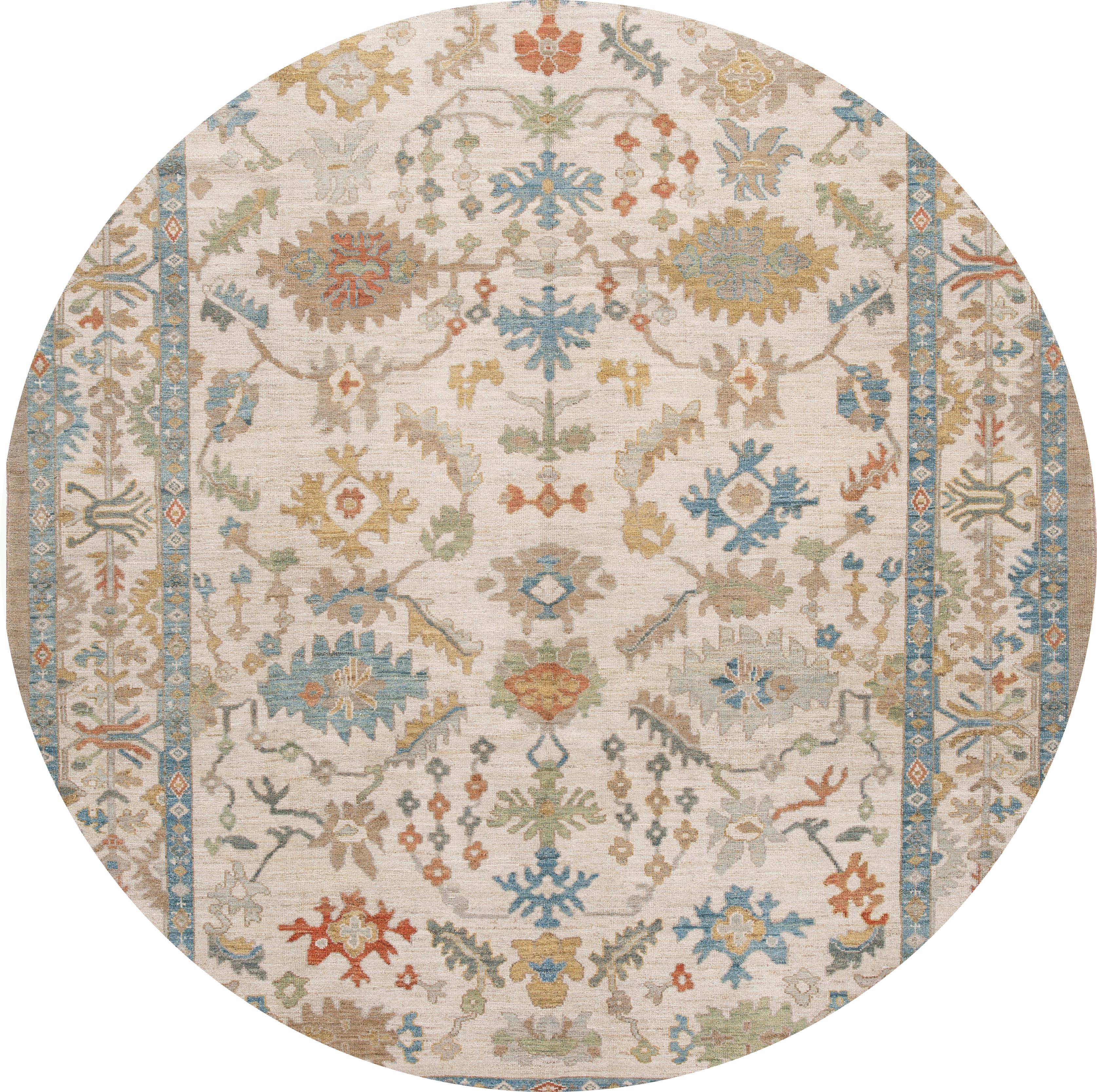 Beautiful contemporary Sultanabad rug, hand knotted wool with an ivory field, tan frame, blue, rust and dark yellow accents in all-over classic design.
This rug measures9' 4