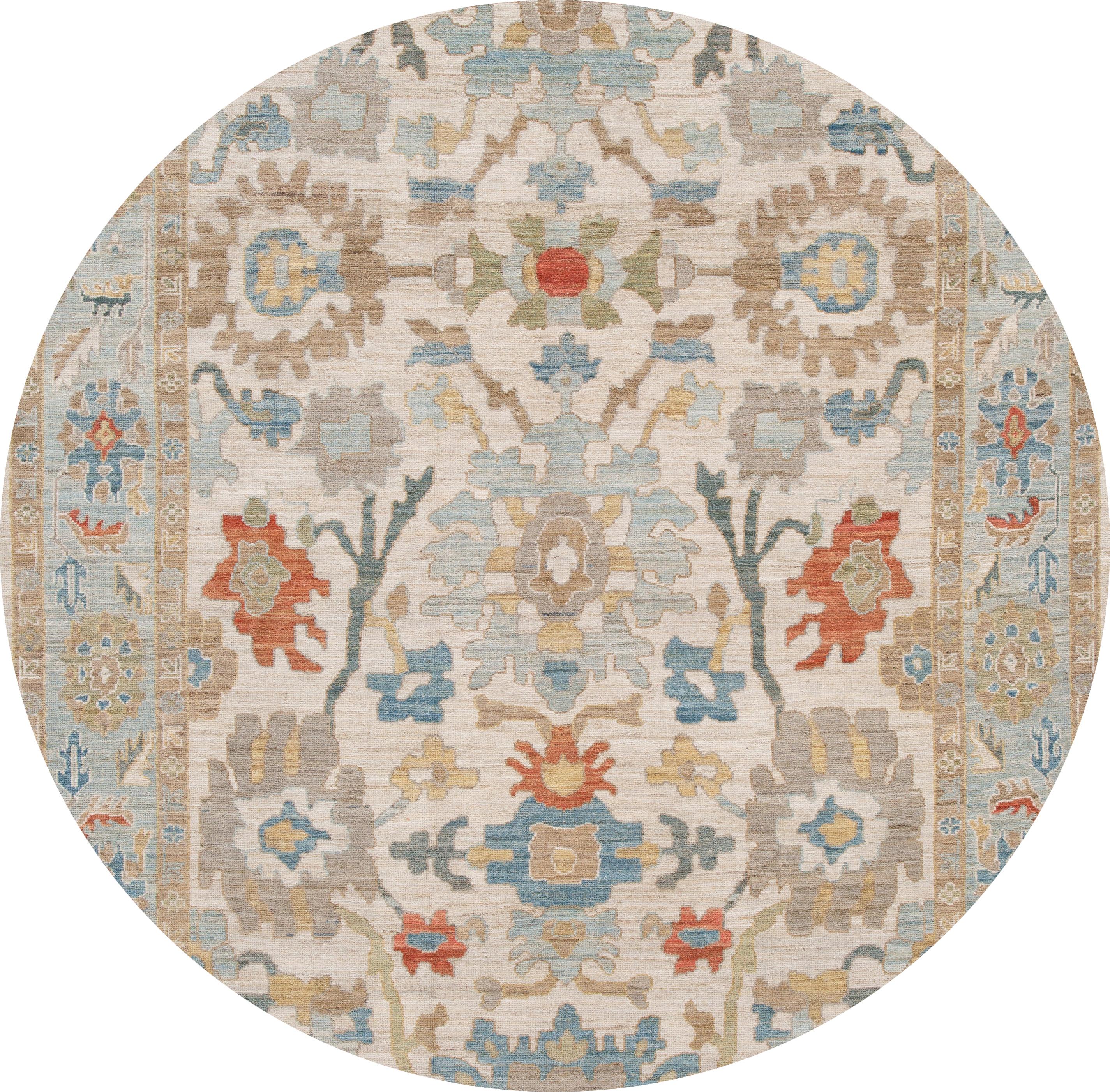 Beautiful contemporary Sultanabad rug, hand knotted wool with an ivory field, light blue frame, tan, rust and blue accents in all-over Classic floral design.
This rug measures: 8'1