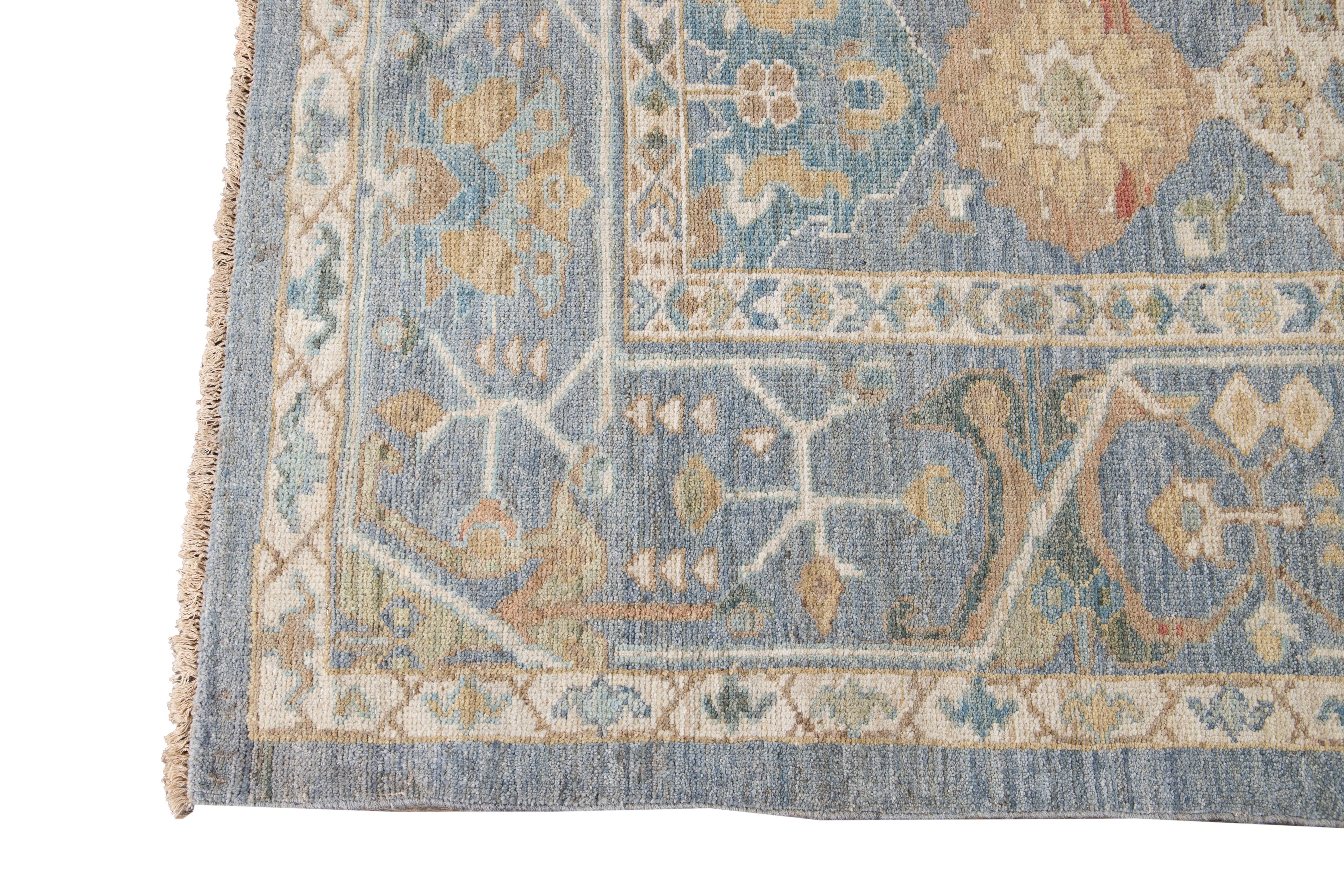 Beautiful contemporary Sultanabad rug, hand knotted wool with a blue field, slim tan frame, dark gold, ivory, and dark blue accents in all-over Classic design.
This rug measures: 9'3