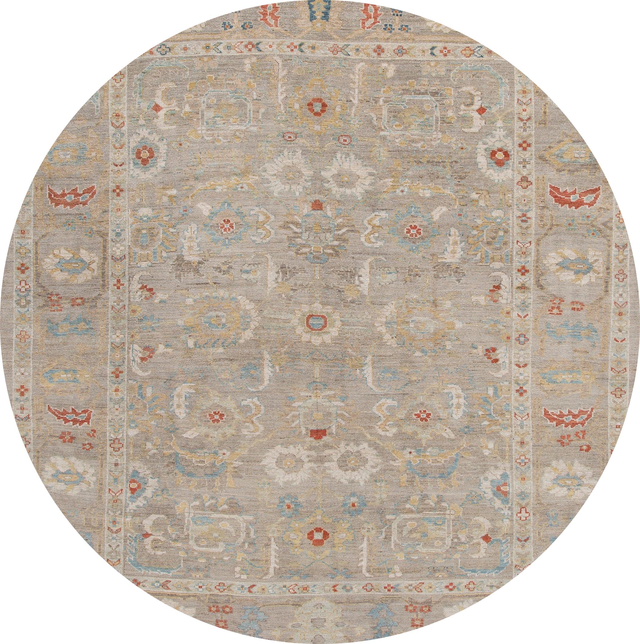Beautiful contemporary Sultanabad rug, hand knotted wool with a beige field, ivory, blue, and red accents in all-over Classic floral medallion design.

This rug measures: 8'6