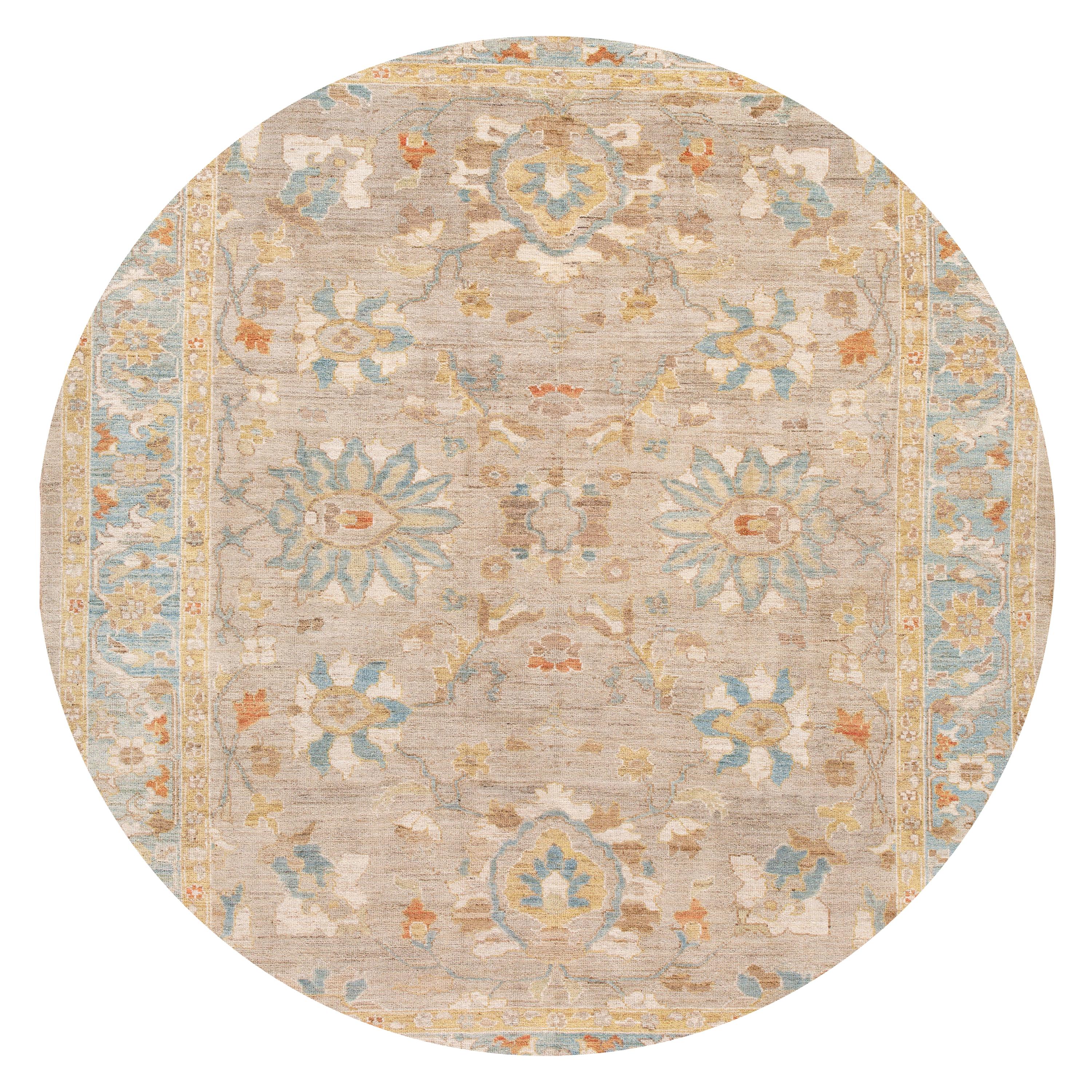 Beautiful contemporary Sultanabad rug, hand knotted wool with a tan field, blue and ivory accents in an all-over design.
This rug measures: 8'8