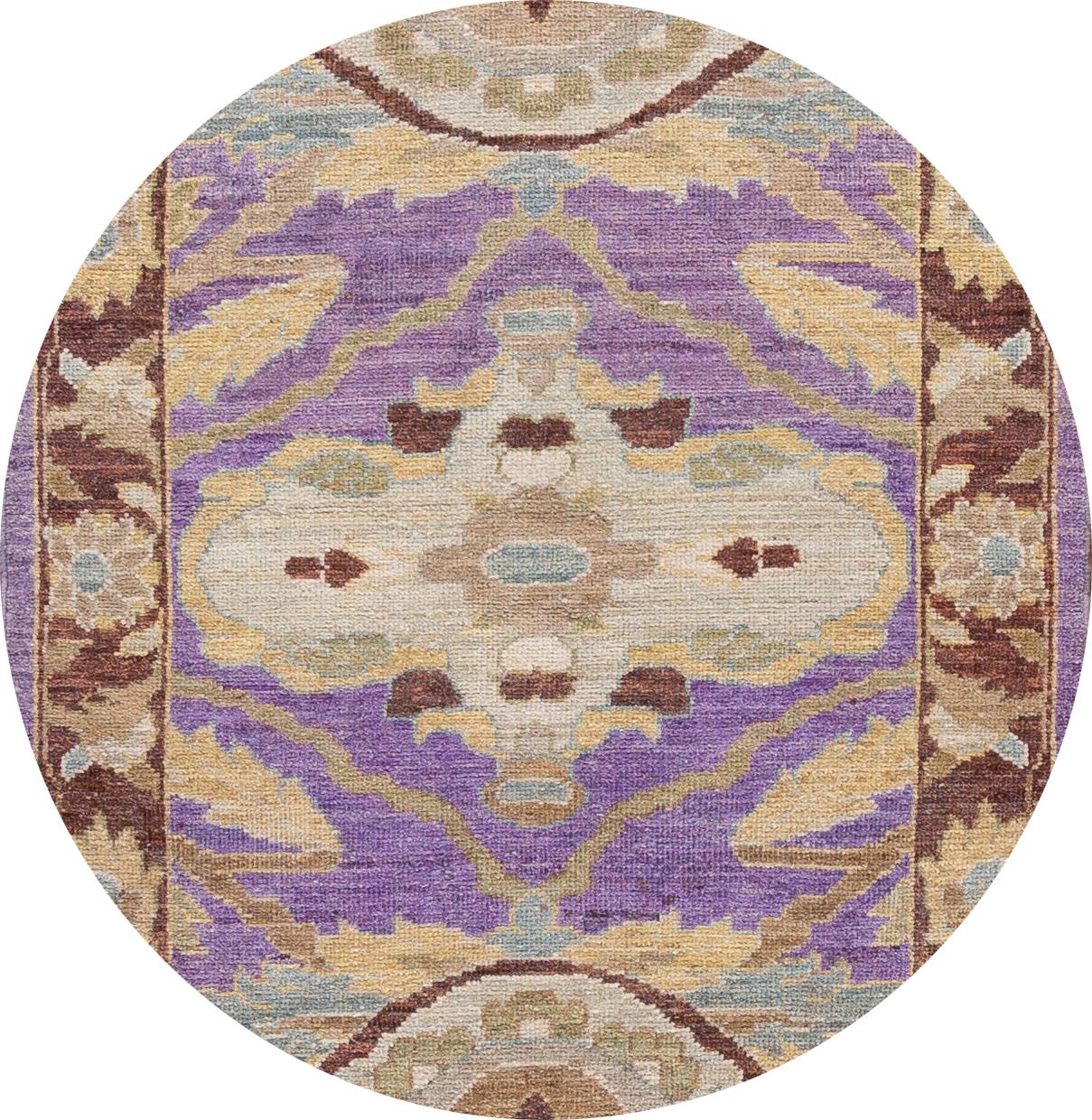 Beautiful Contemporary Sultanabad Runner Rug,hand-knotted wool with a purple field, slim brown frame, tan, and blue accents in an allover design.
This rug measures 3' 5