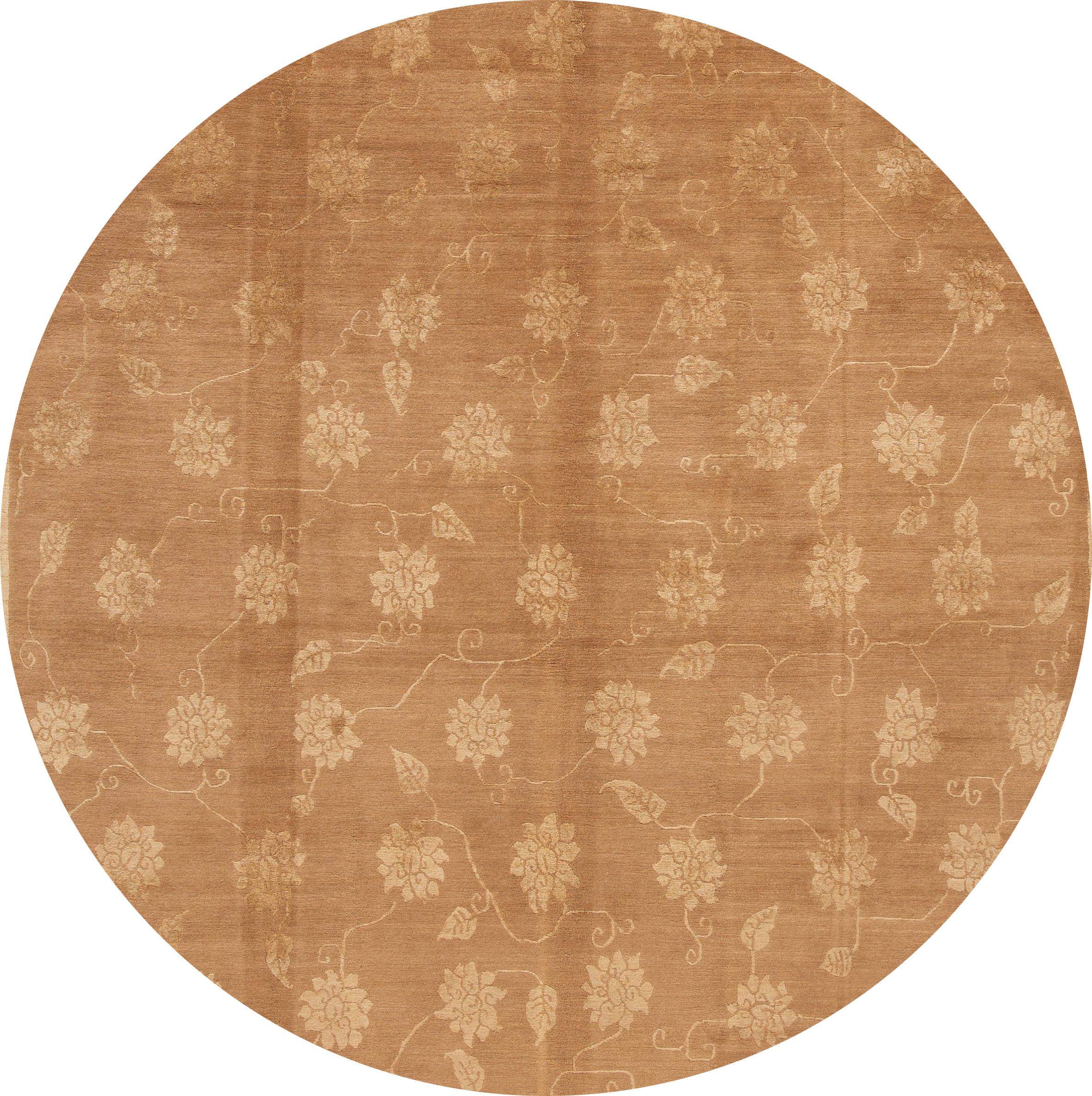A beautiful hand knotted Tibetan rug with a floral design on a light brown back ground.

This rug measures: 8' x 10'.