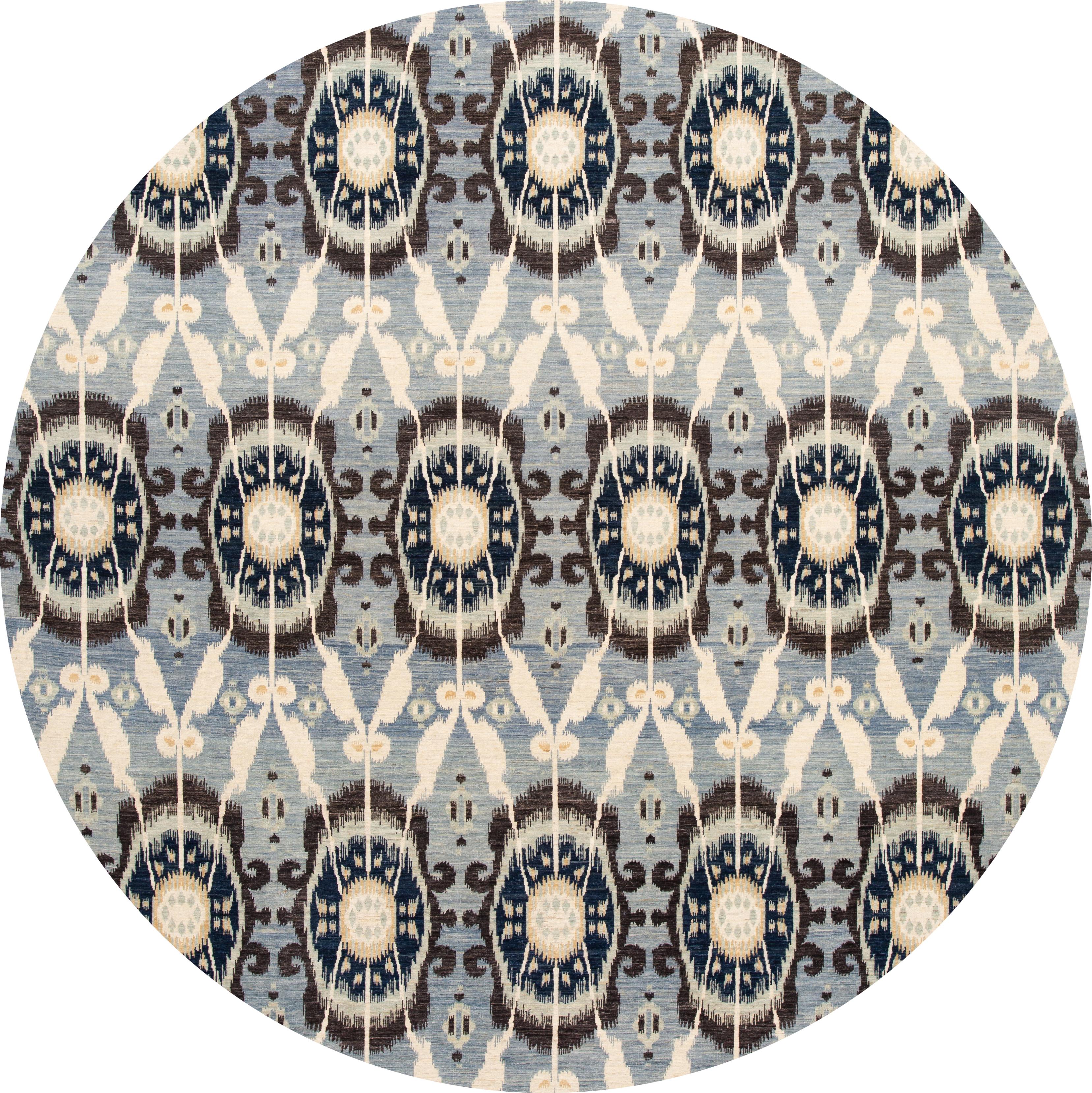 Beautiful hand knotted wool, modern transitional rug. This rug has a blue field with ivory and brown accents in an all-over geometric design. 

This rug measures 10' 7